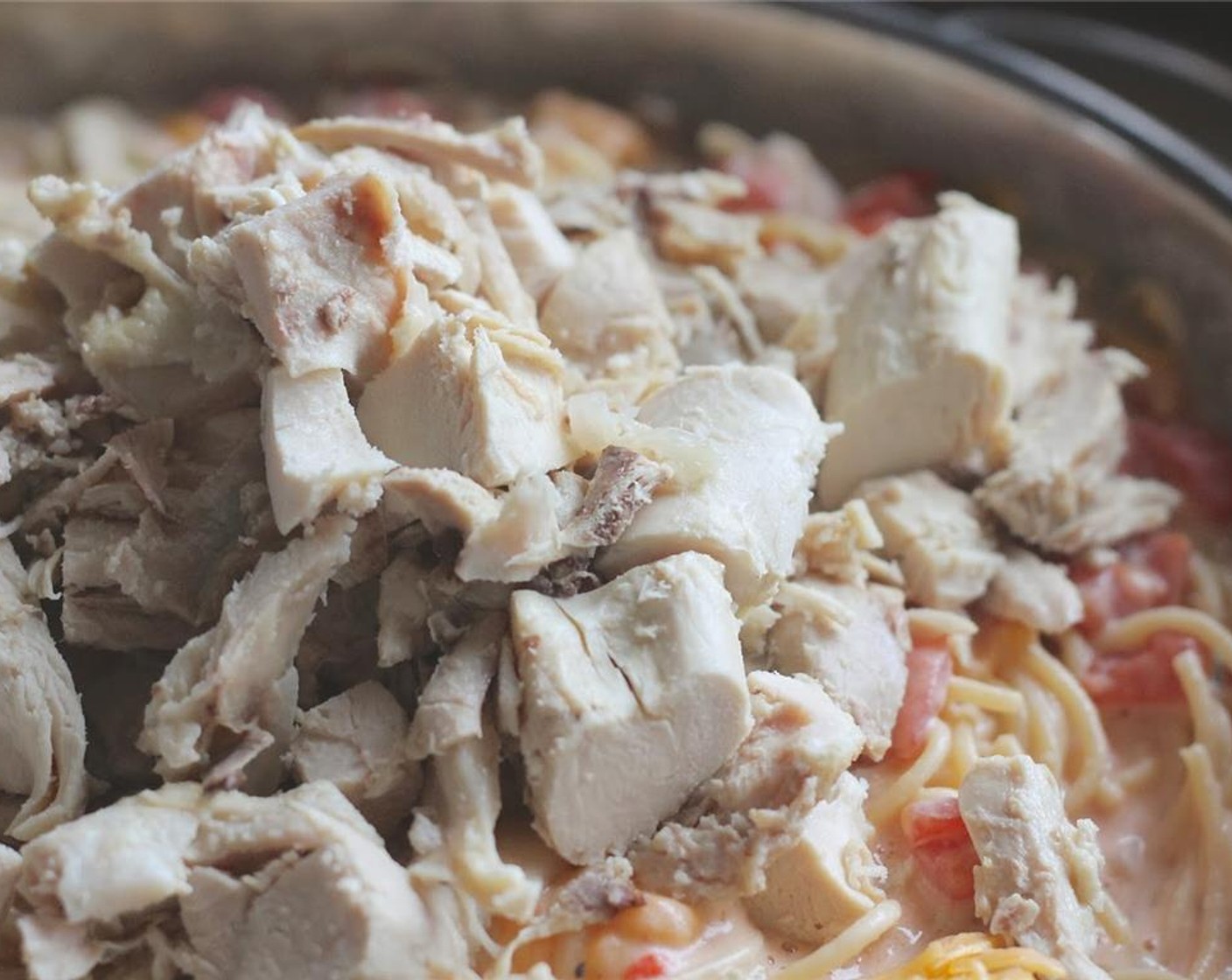 step 14 Add cooked chicken. Stir together well and put into one large lasagna pan, or 2 medium/small casserole pans.