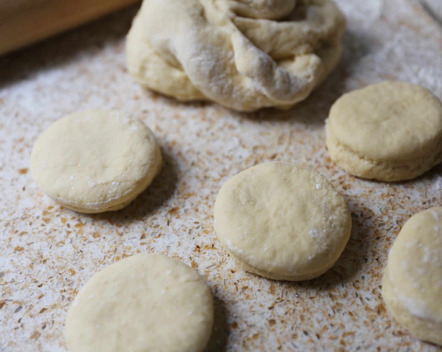 step 7 Using a 2-inch round cookie cutter, cut out as many scones as possible. Gather leftover dough, roll and continue cutting out scones until you've used up all the dough.