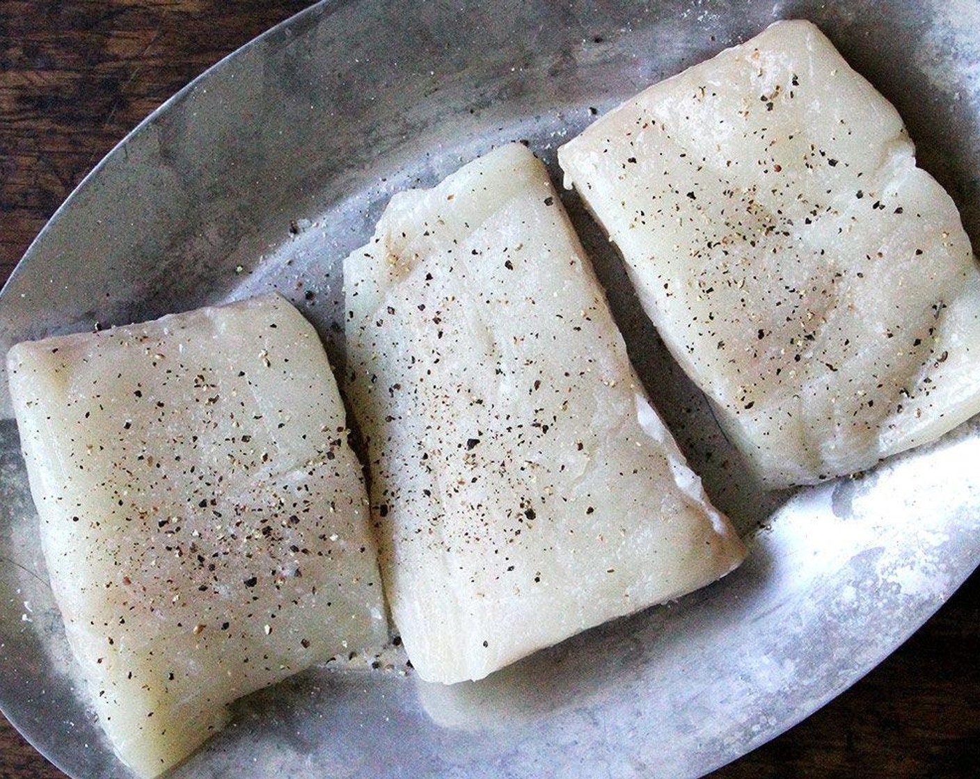 step 3 Season the Halibut Fillets (4) with Kosher Salt (to taste) and Freshly Ground Black Pepper (to taste). Spread the mayonnaise mixture evenly over each of the fillets.