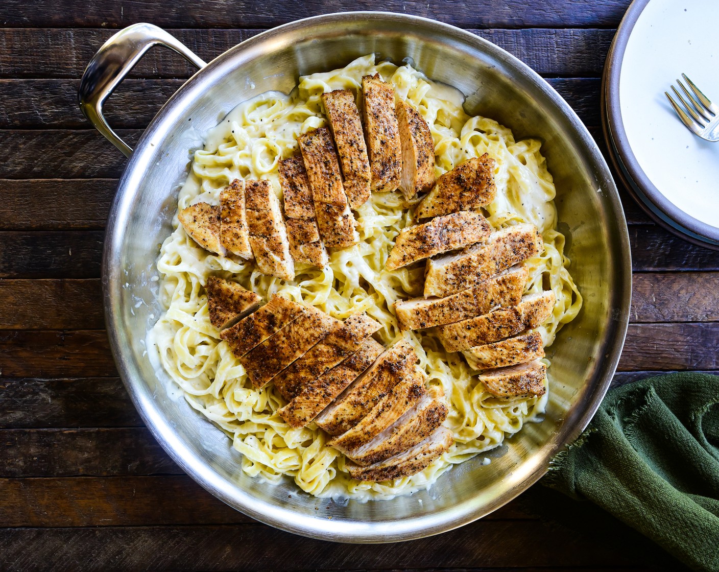 step 6 To serve, cut chicken breast into slices and place on top of the fettuccine alfredo.