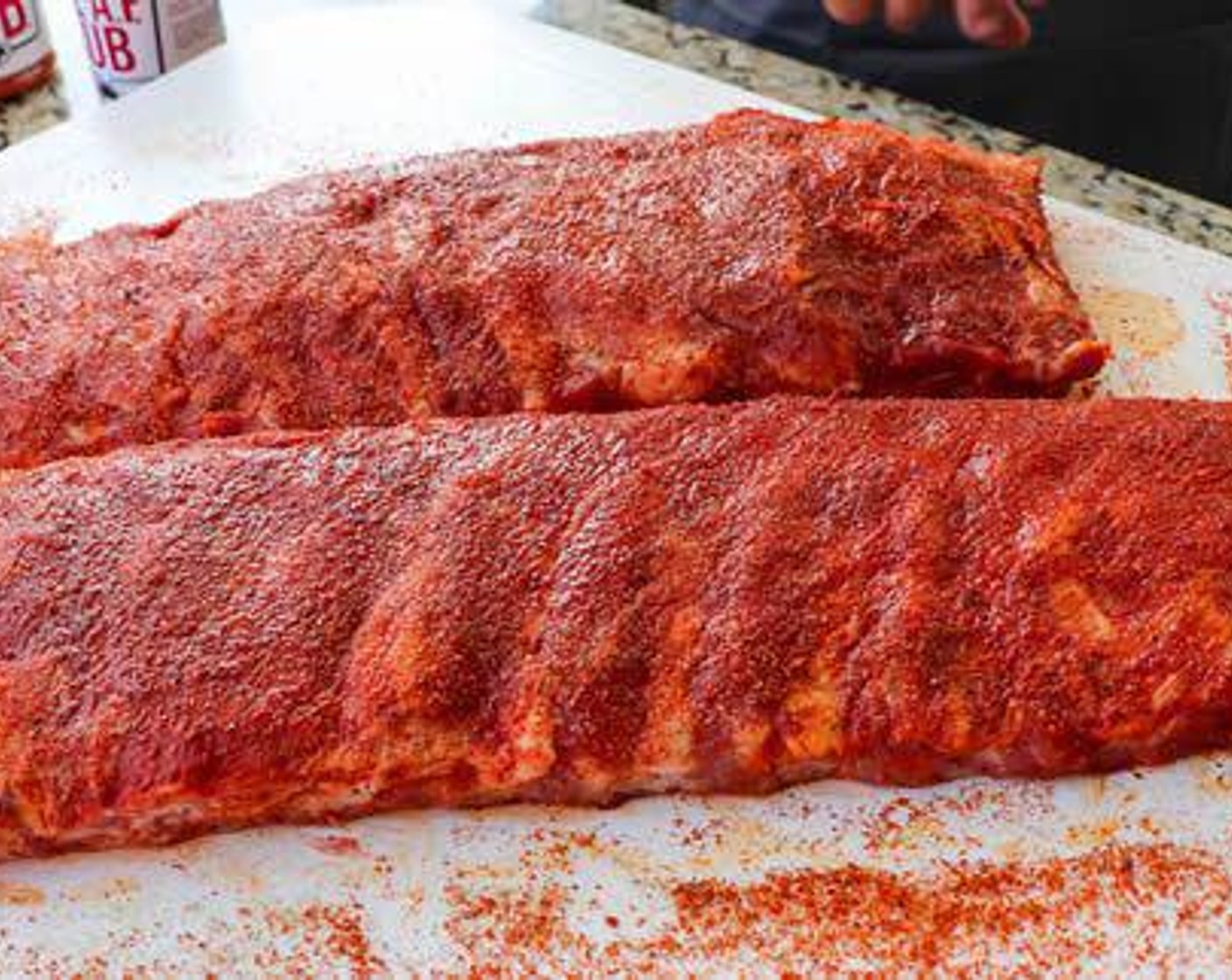 step 3 Season each slab on both sides with All-Purpose Spice Rub (1/4 cup) followed by Barbecue Rub (1/4 cup).