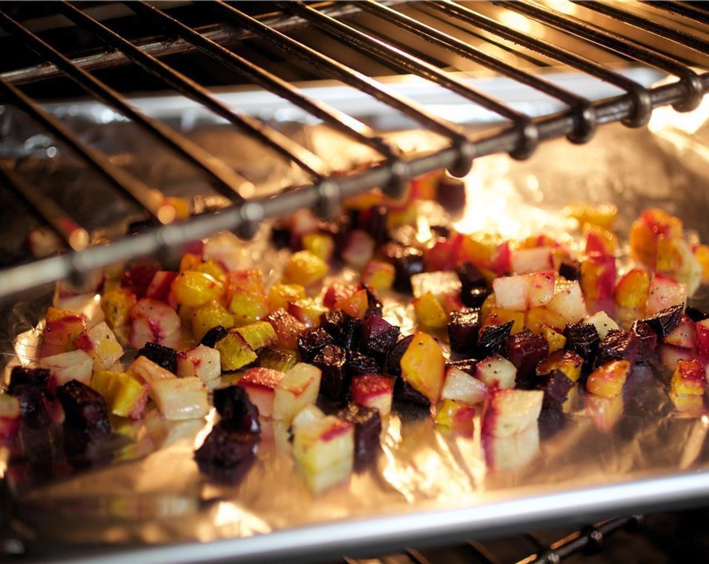 step 4 Lay beets and potatoes in a single layer on a foil-lined sheet pan and roast in the oven for 30 minutes. Rinse and pat dry bowl.