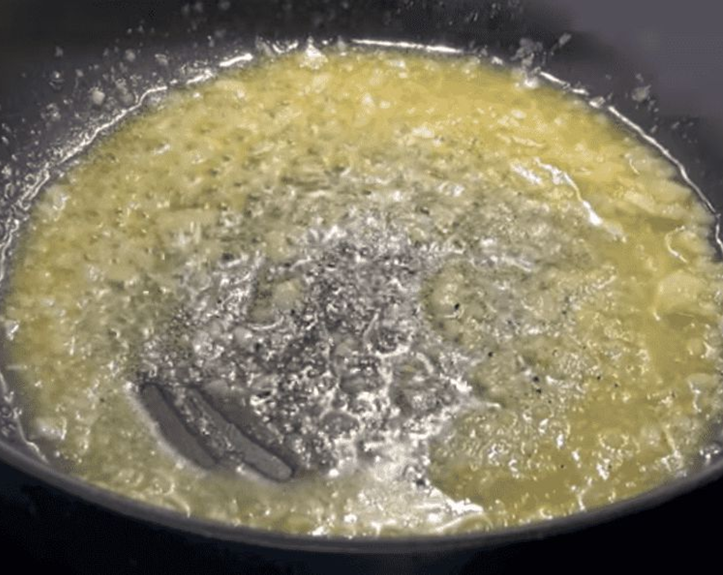 step 2 To the pot, add Butter (1 Tbsp) and Freshly Ground Black Pepper (to taste).