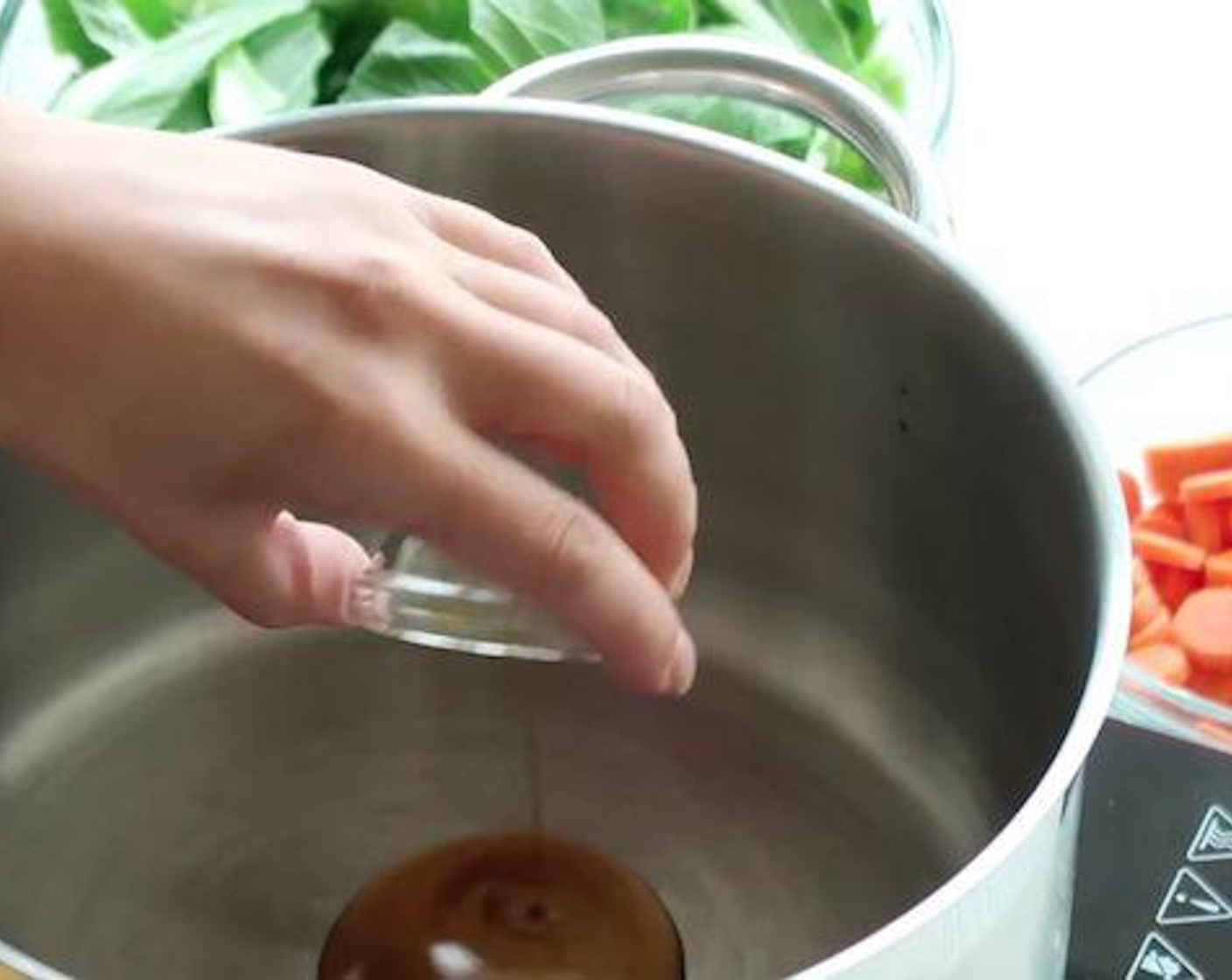 step 1 Heat Peanut Oil (1 Tbsp) in a large pot over medium heat.