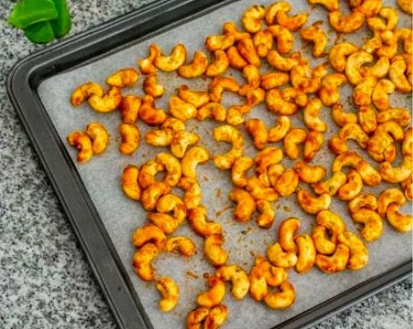 step 3 Spread cashews on the baking sheet.