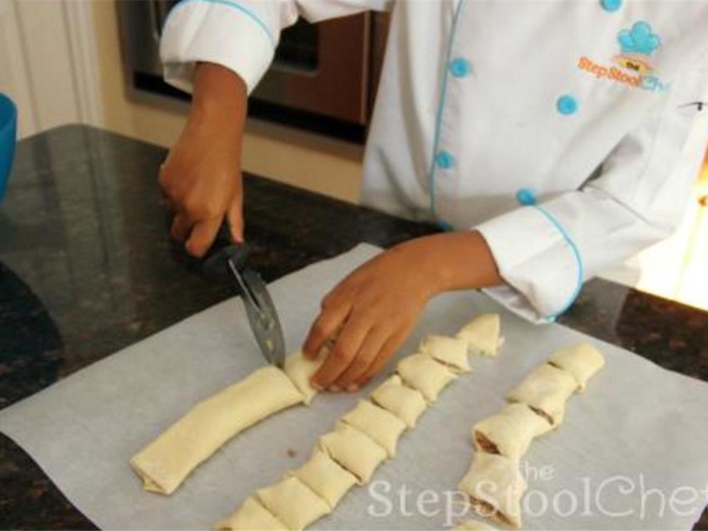 Step 6 of Sausage Bites With Maple Lemon Sauce Recipe: Cut each roll into small equal pieces.