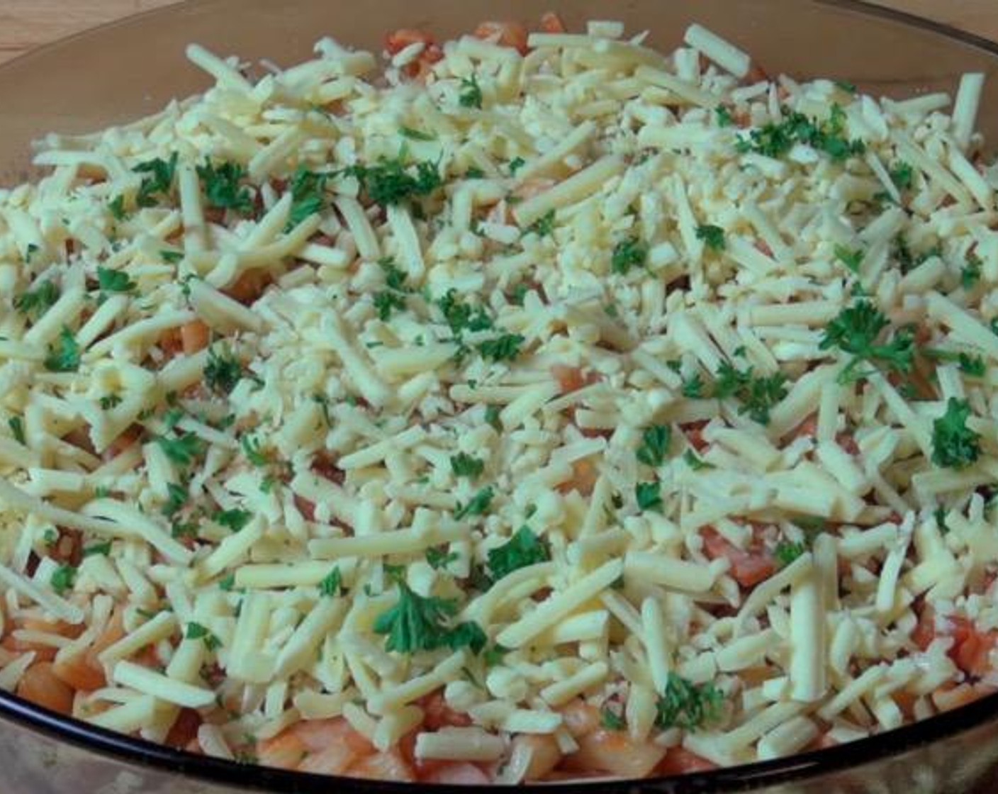 step 4 Add the sauce to Pasta (9 oz) and stir to combine. Transfer into a lightly greased baking dish. Top with Cheese (1 1/2 cups) and additional Fresh Parsley (to taste).