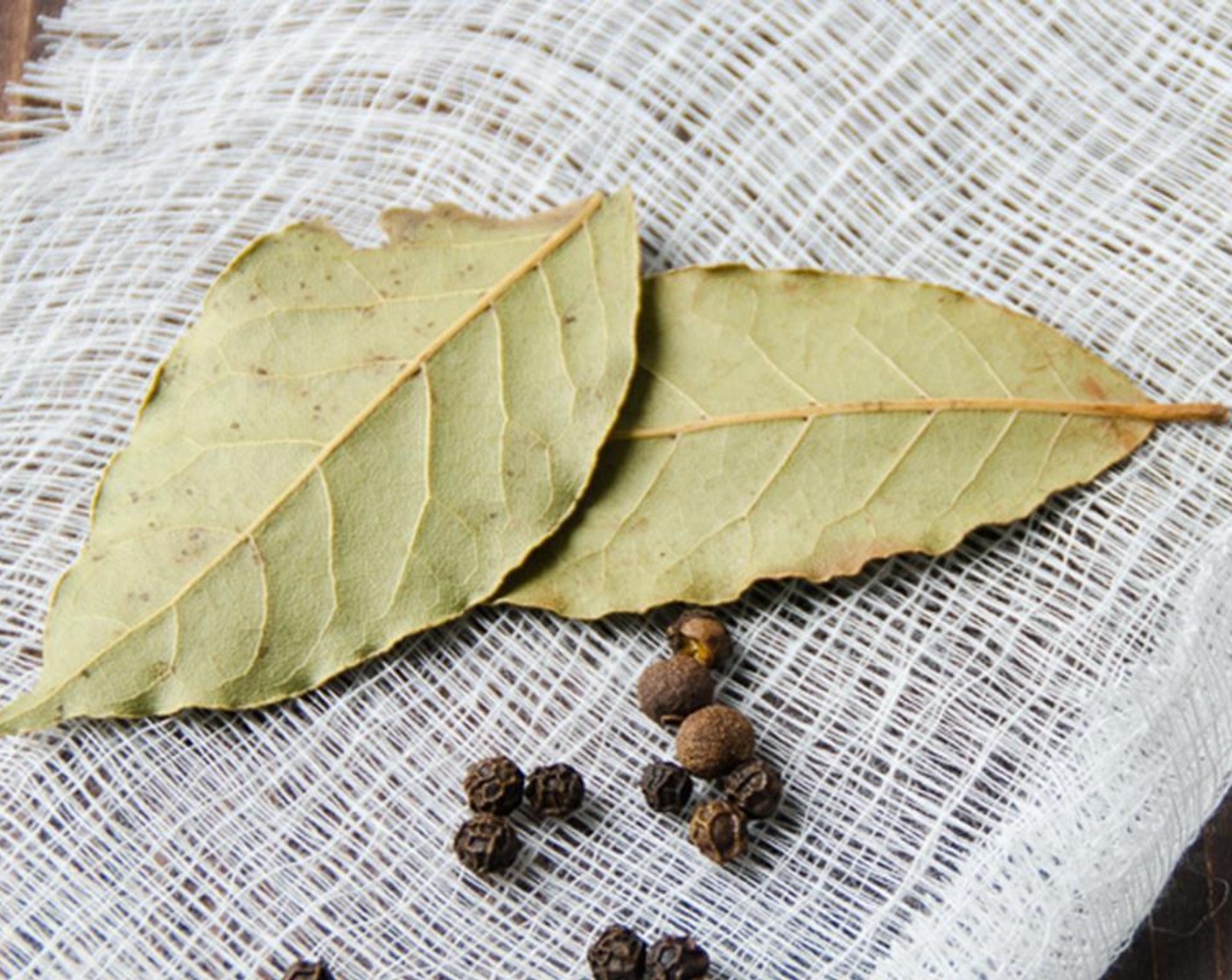 step 2 Place Peppercorns (10), Bay Leaves (2), and Whole Allspice (2) on a piece of cheesecloth and secure with a string and deposit it into the pot with the chicken