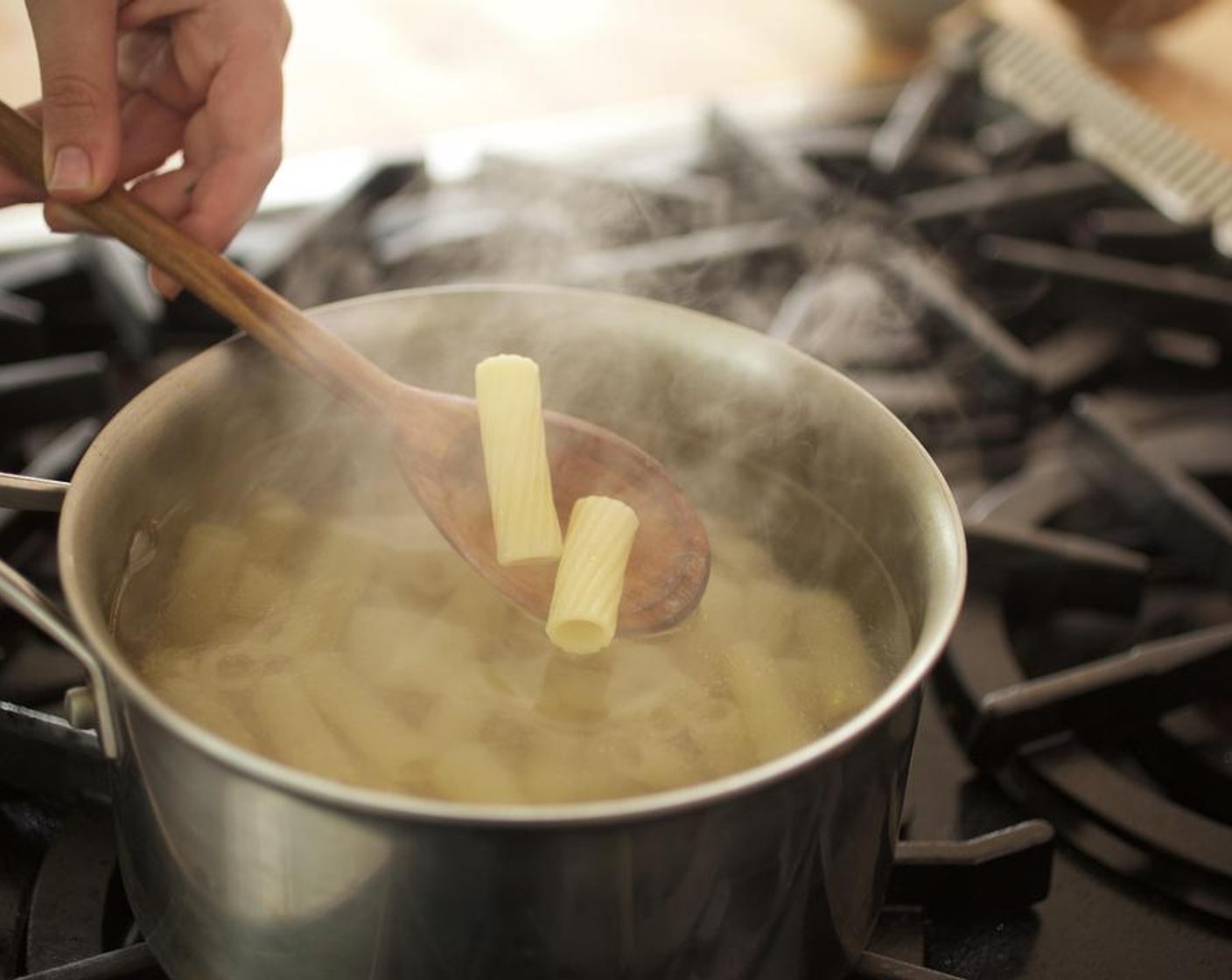 step 6 Once the water is at a boil, add the Rigatoni (8 oz) and cook for 9 minutes, until just shy of al dente. Softly stir ever 3 minutes, carefully, so you don't break the shells.