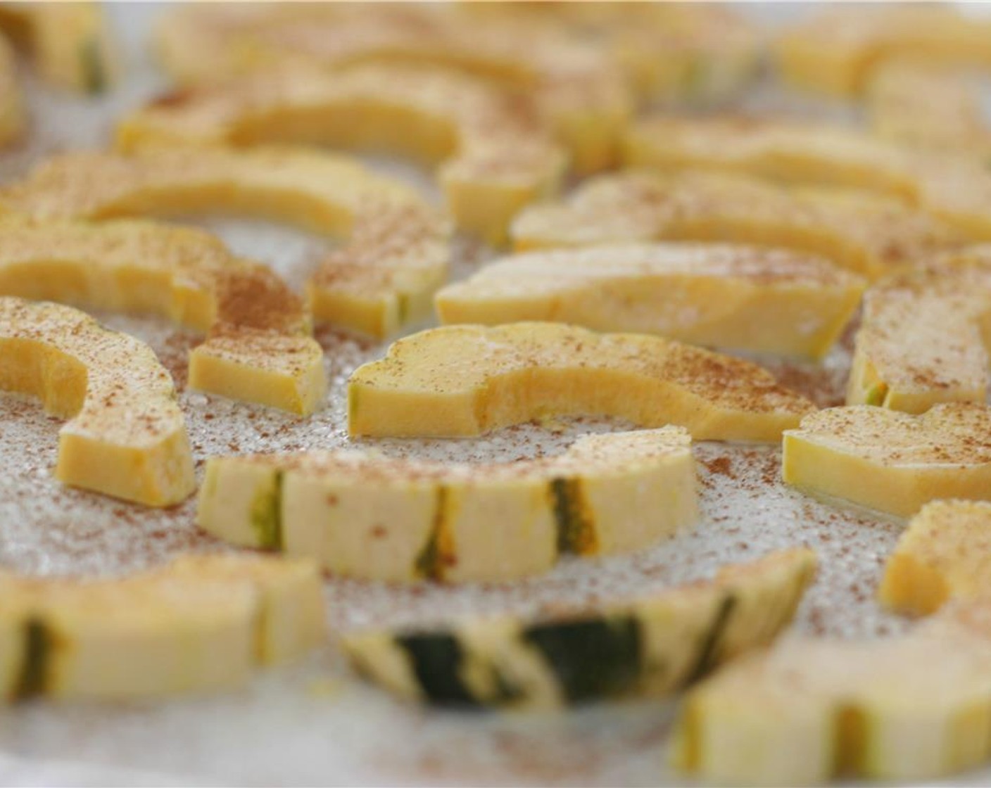 step 3 Spray with additional Nonstick Cooking Spray (as needed). Sprinkle with a few grinds of Sea Salt (to taste), Simply Organic Cinnamon, Ground (1 tsp). Place the baking sheet in the oven for 30 minutes, flipping the squash halfway through.