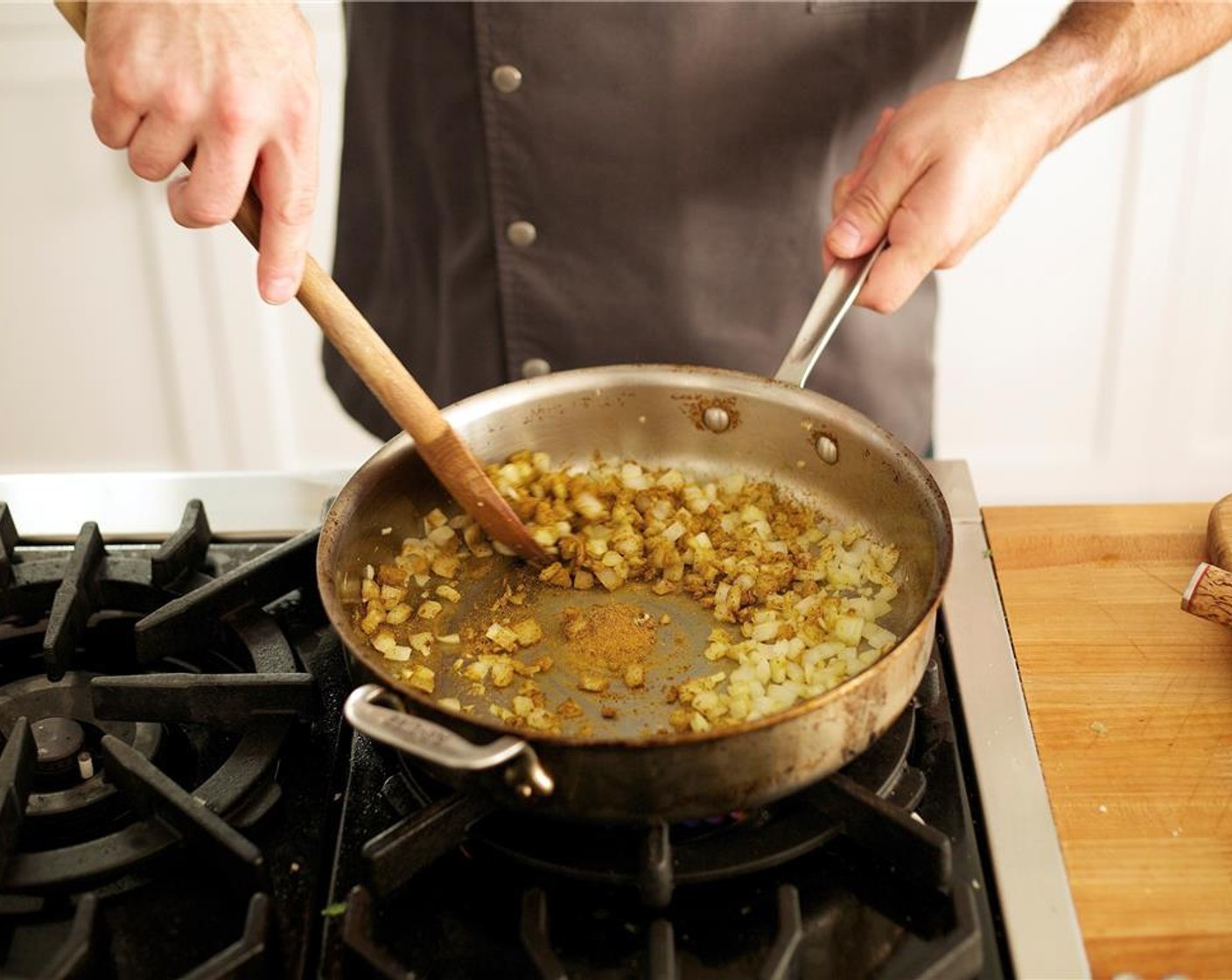 step 11 Heat 1 tablespoon of olive oil in a large three-inch deep saute pan over medium-high heat. Add onions and remaining ginger garlic paste. Cook until onions are tender, about 6 minutes.