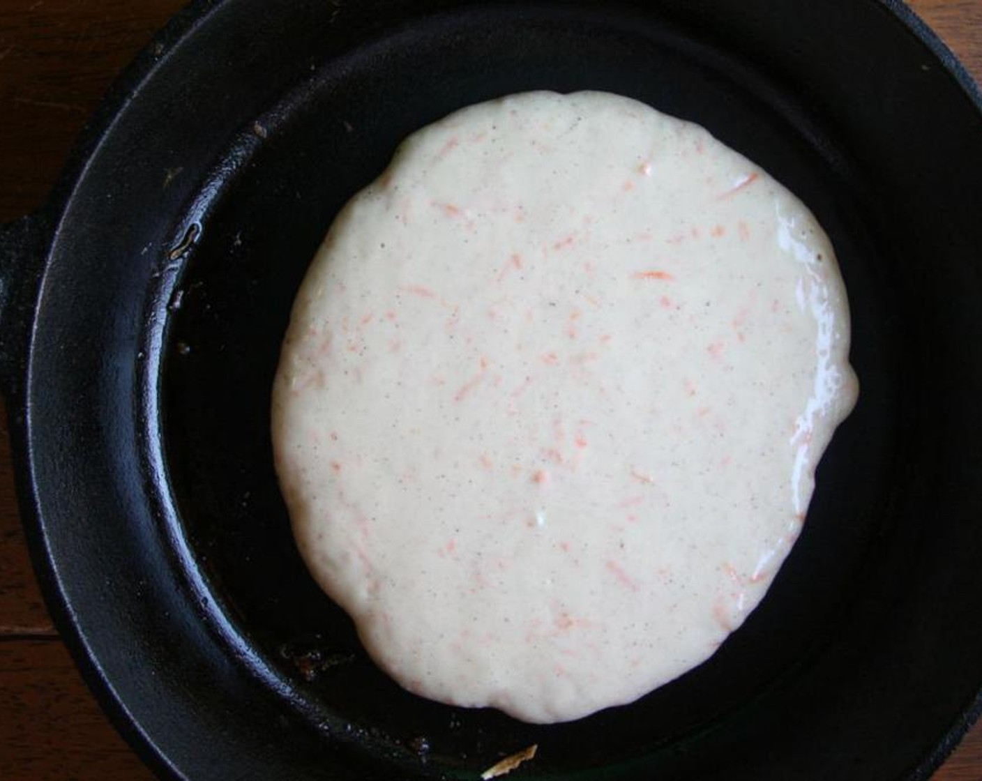 step 3 Pour batter by 1/2 cup measuring cup onto a greased skillet over medium heat. Wait until you see bubbles appear and flip to cook the other side.