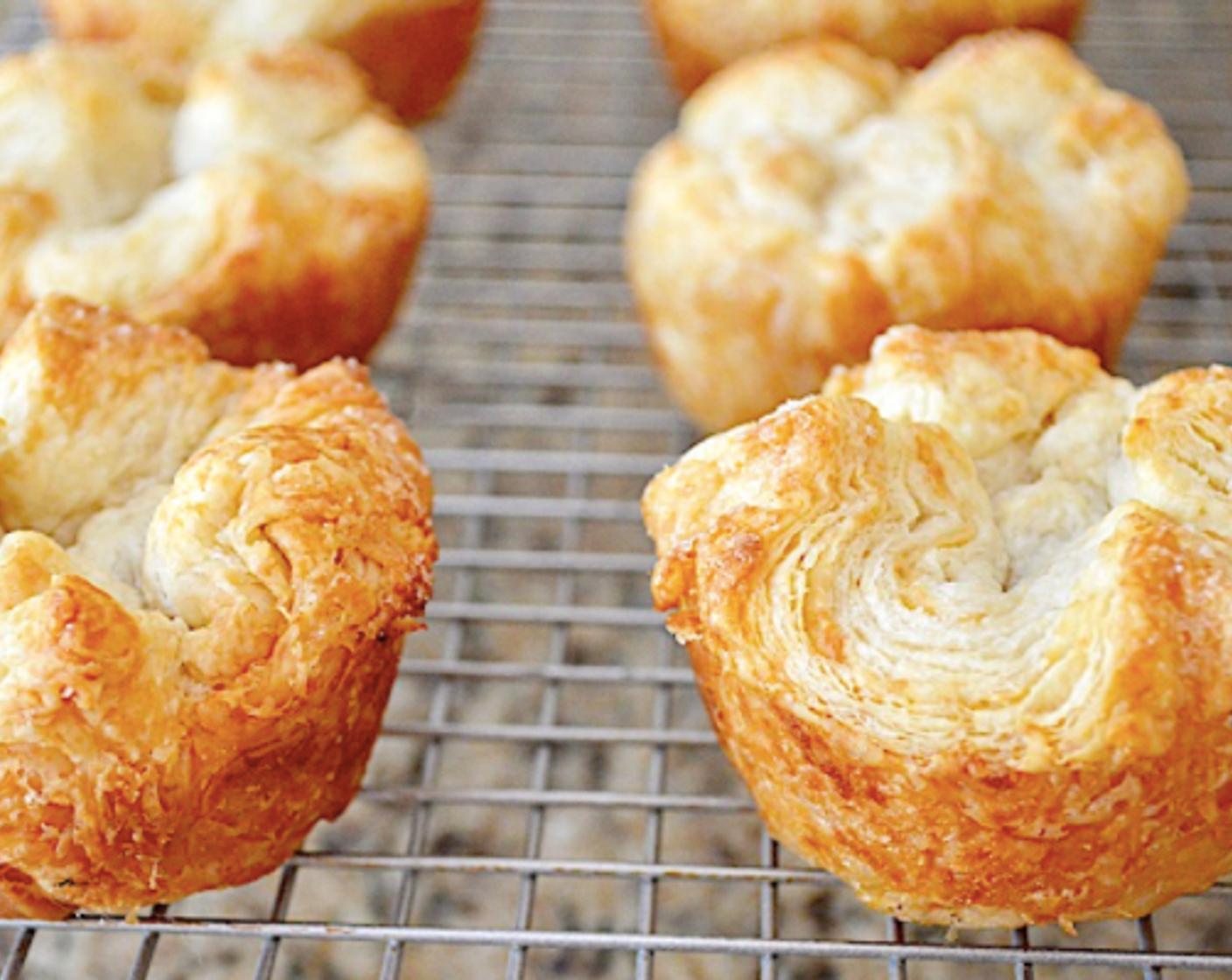 step 12 When they are done rising, preheat the oven to 350 degrees F (180 degrees C). Bake the kouign amann for 35-40 minutes, until they are completely flaky and golden.