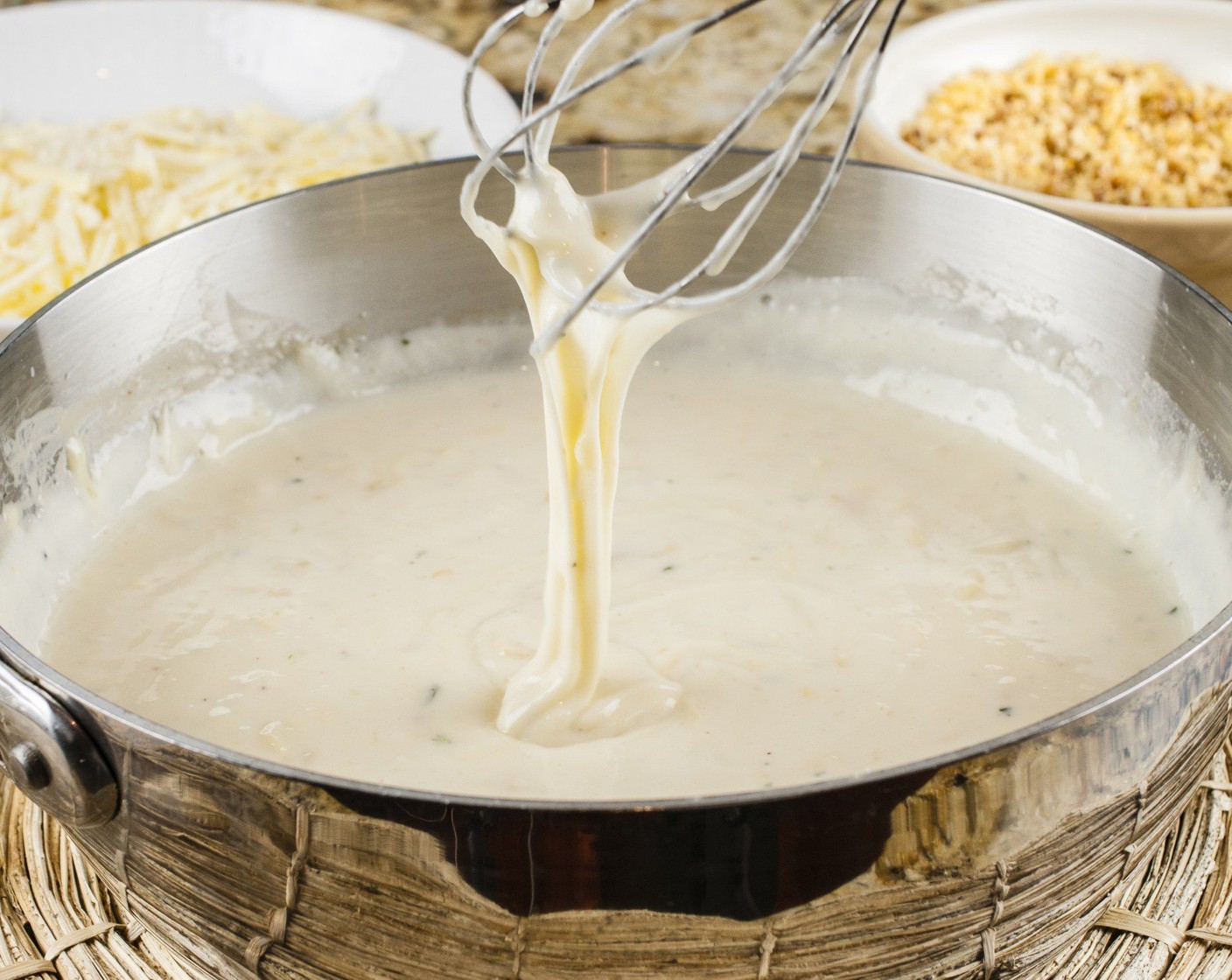 step 11 Add remaining Smoked Gouda (225 g) and White Cheddar Cheese (240 g) to the sauce, stirring until melted. Add cooked macaroni and stir to combine.