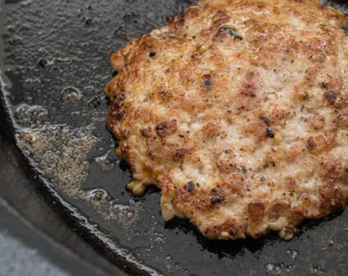 step 9 Carefully place the patties on to the skillet and allow to sear, without touching, for about 1 minute on each side until fully cooked.