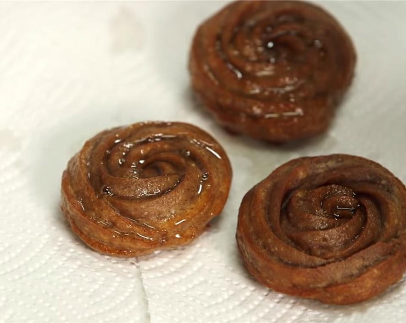 step 12 Quickly toss them in the sugar mixture while they are still hot. Continue working in small batches until all of the churros are fried.