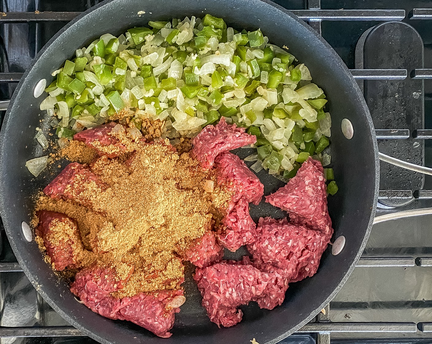 step 2 Stir in Garlic (5 cloves) and cook for 2 minutes. Add in 96/4 Lean Ground Beef (1 lb) and Taco Seasoning (1 packet) and sauté until brown for 7 minutes.