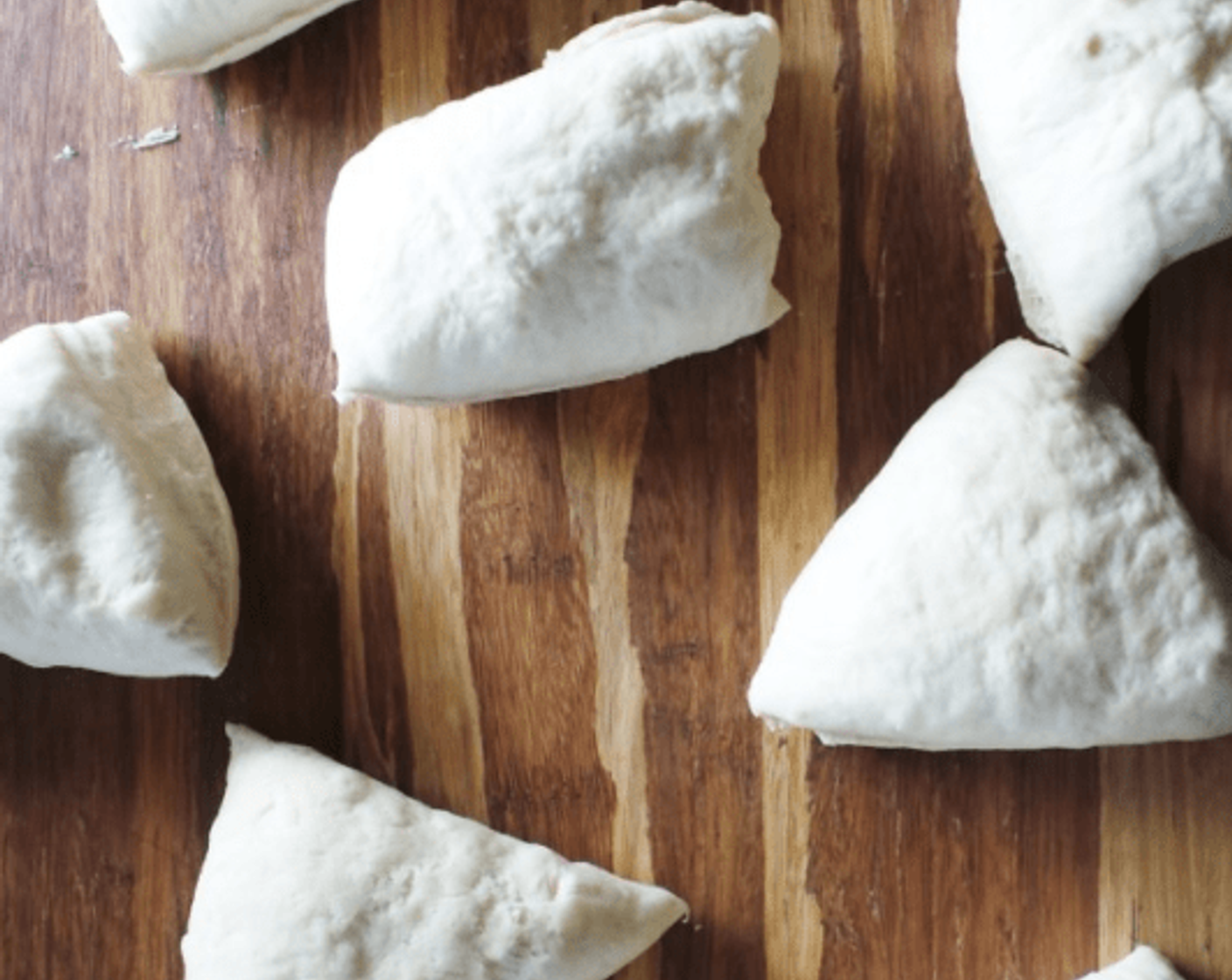 step 5 Carefully divide the dough into 8 pieces. Shape each piece into a round.