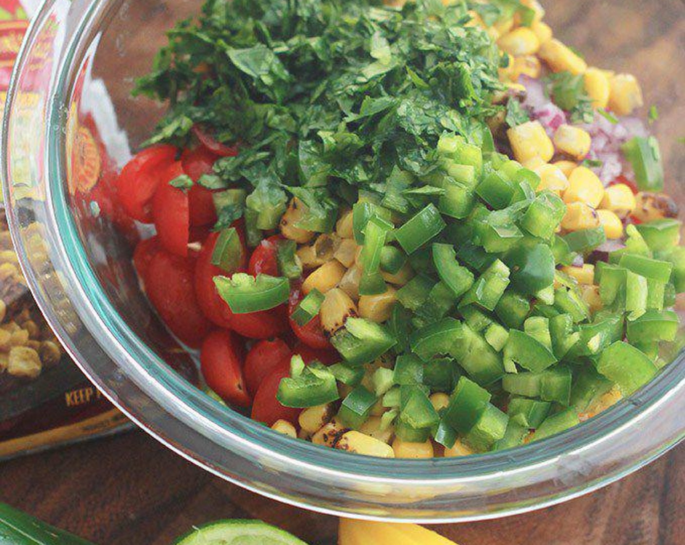 step 1 In a medium bowl, combine Grape Tomatoes (1 1/3 cups), Fire Roasted Corn Kernels (1 cup), Red Onion (1/3 cup), Garlic (2 cloves), Jalapeño Pepper (1) and Fresh Cilantro (1/4 cup). Add zest and juice from Lime (1) and Sea Salt (1/2 tsp). Stir to combine.