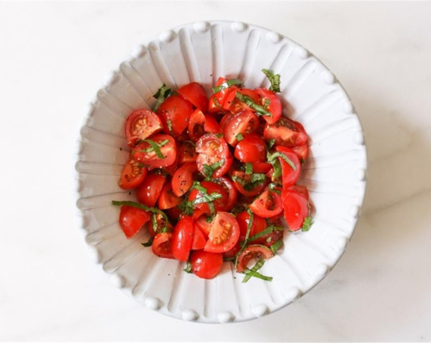 step 1 In a small bowl, combine the Cherry Tomato (1 cup), Olive Oil (1 Tbsp), and Fresh Basil Leaves (8). Season with Kosher Salt (to taste) and Freshly Ground Black Pepper (to taste), and briefly set that deliciousness aside.