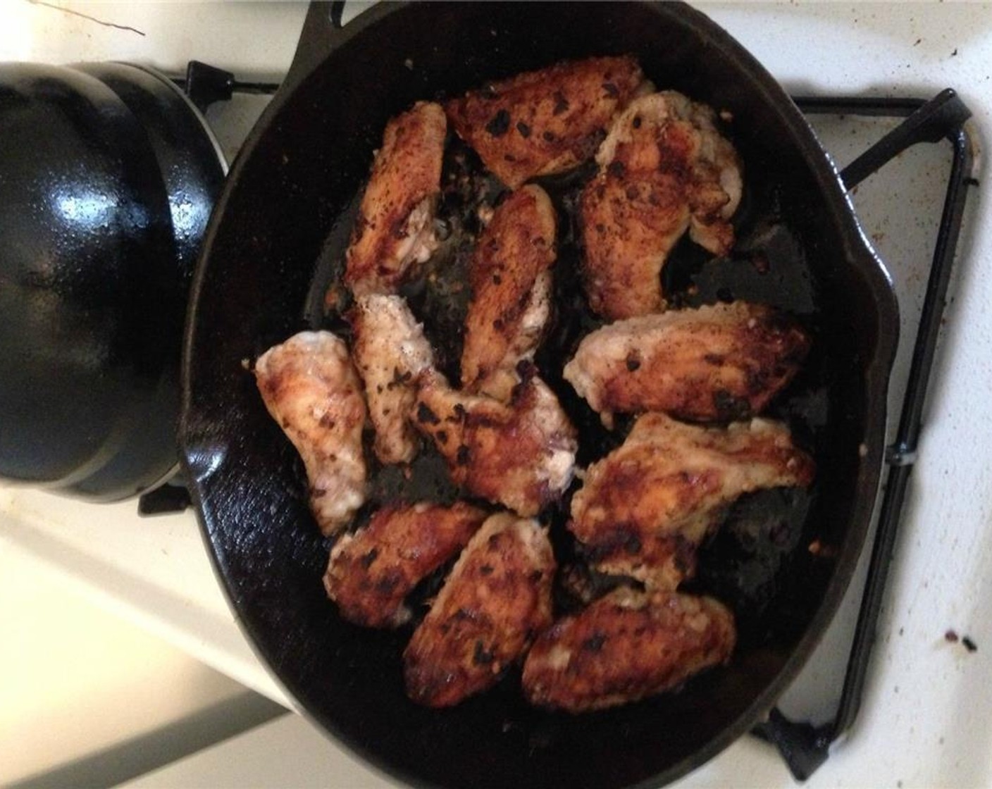 step 4 Flip the wings, add Frank's® RedHot® Sauce (to taste), and continue cooking for another 10-15 minutes.