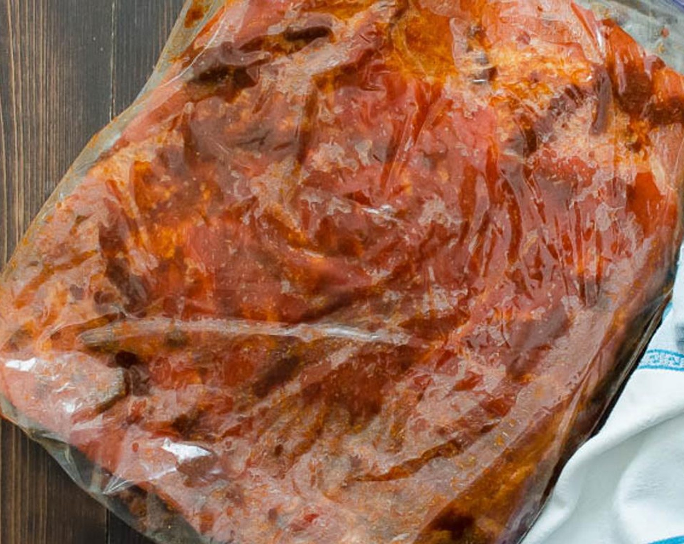 step 3 Place the belly in the plastic bag and add half of the curing mixture to the top of the belly. Use your hands to rub it into the flesh, evenly coating. Flip over and rub the remaining curing mix onto the other side of the pork belly.