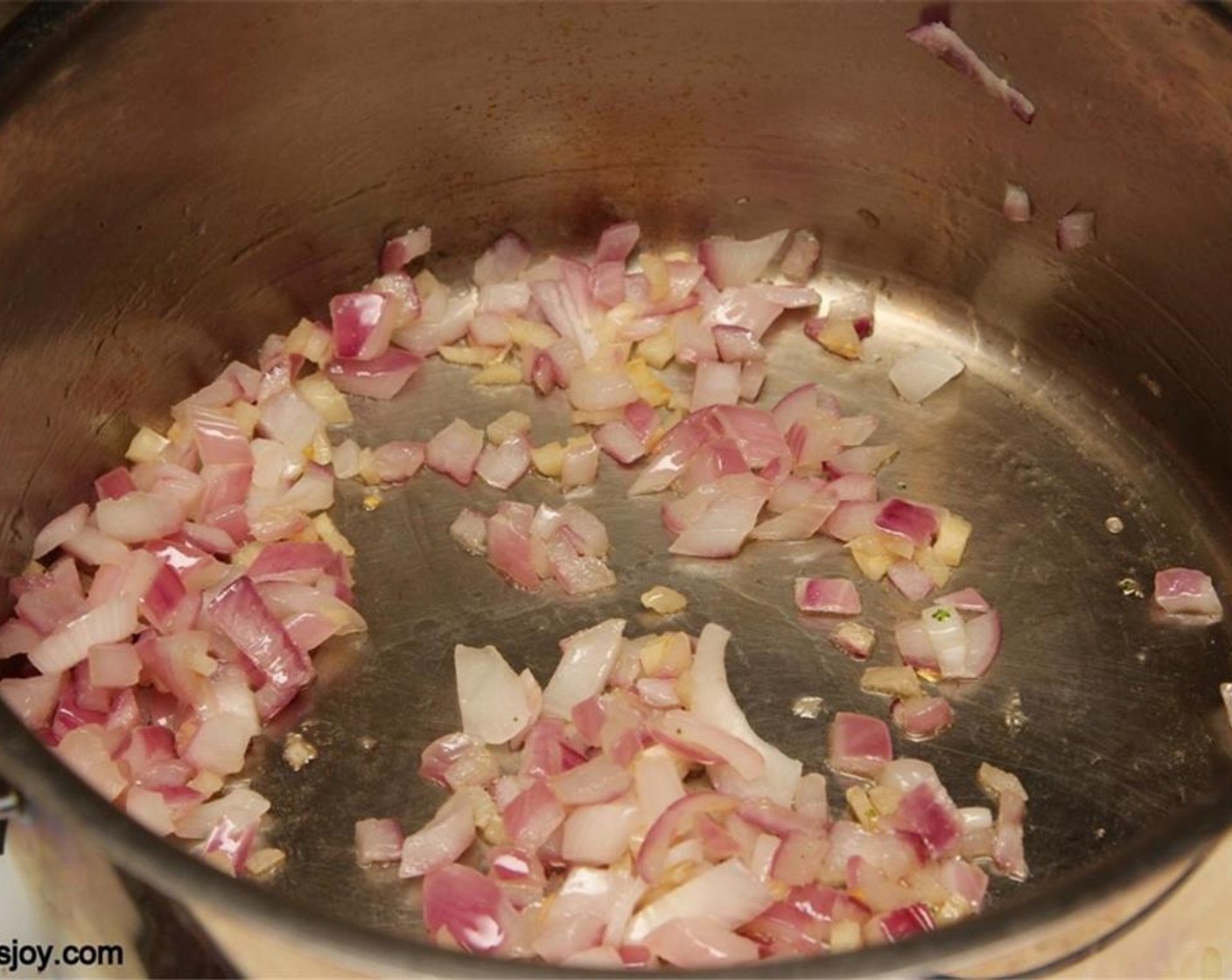 step 1 Heat the Olive Oil (1/2 Tbsp) in a pot and add the Onion (3/4 cup) and Garlic (2 cloves). Sauté until the onions are cooked.