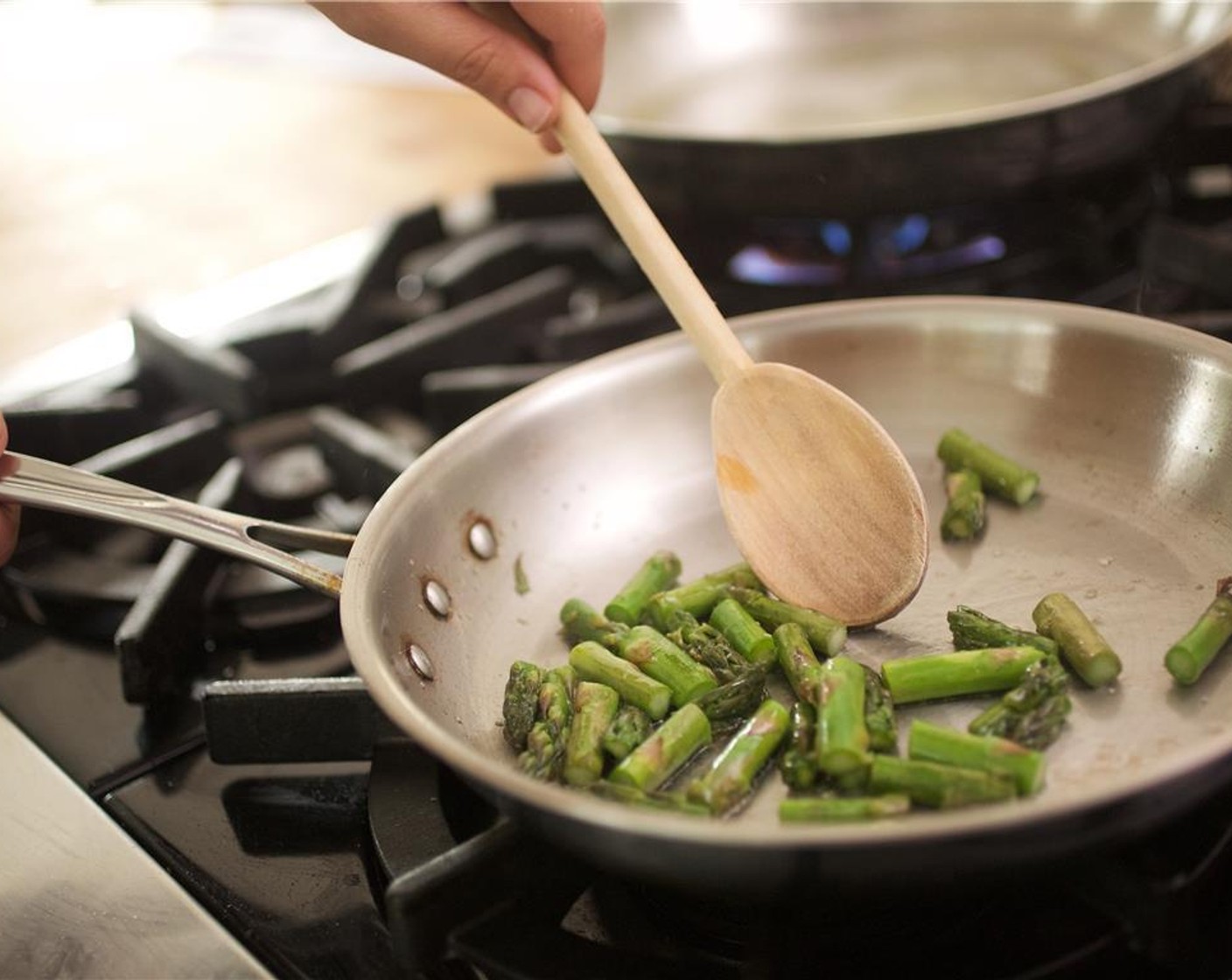 step 7 Heat a medium saute pan over medium high heat. Add Canola Oil (1 Tbsp). When hot, add asparagus and Salt (1/2 tsp) and saute for 1 minute.