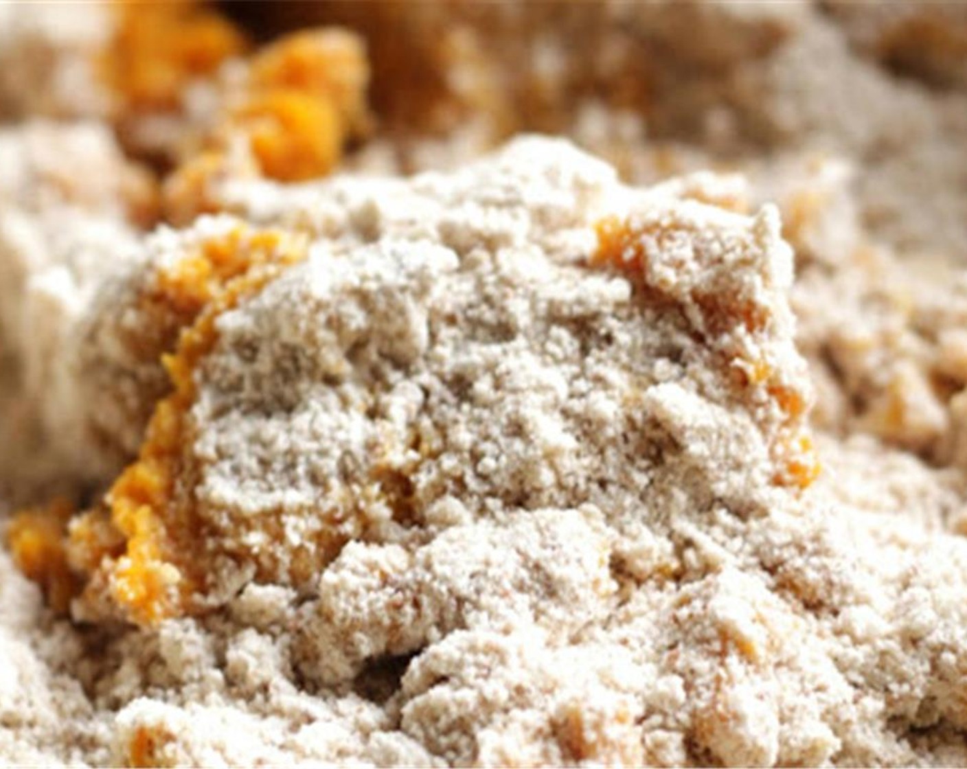 step 4 In a separate bowl, measure together Canned Pumpkin Purée (170 g), Buttermilk (4 Tbsp), and Egg (1), Cinnamon Essential Oil (10 drops), Clove Essential Oil (4 drops), and Vanilla Extract (2 tsp) and Salt (1/2 tsp) the wet ingredients to the dry ingredients and mix together. Also add in Ground Nutmeg (1/2 tsp).