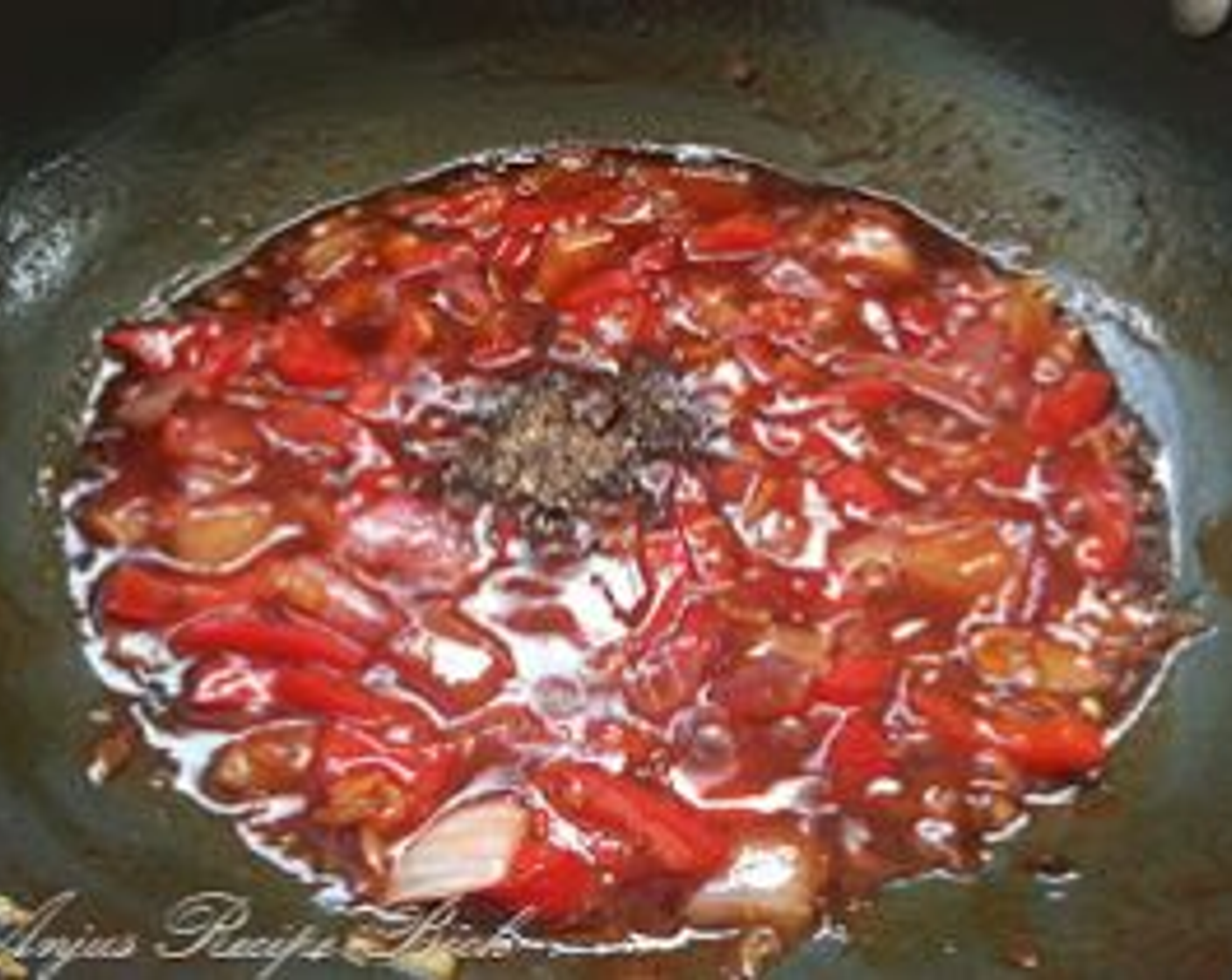 step 8 Now reduce the flame and add Soy Sauce (1 1/2 Tbsp), Chili Sauce (2 tsp), and Tomato Sauce (1 1/2 Tbsp). Combine well and add Ground Black Pepper (1/2 tsp).