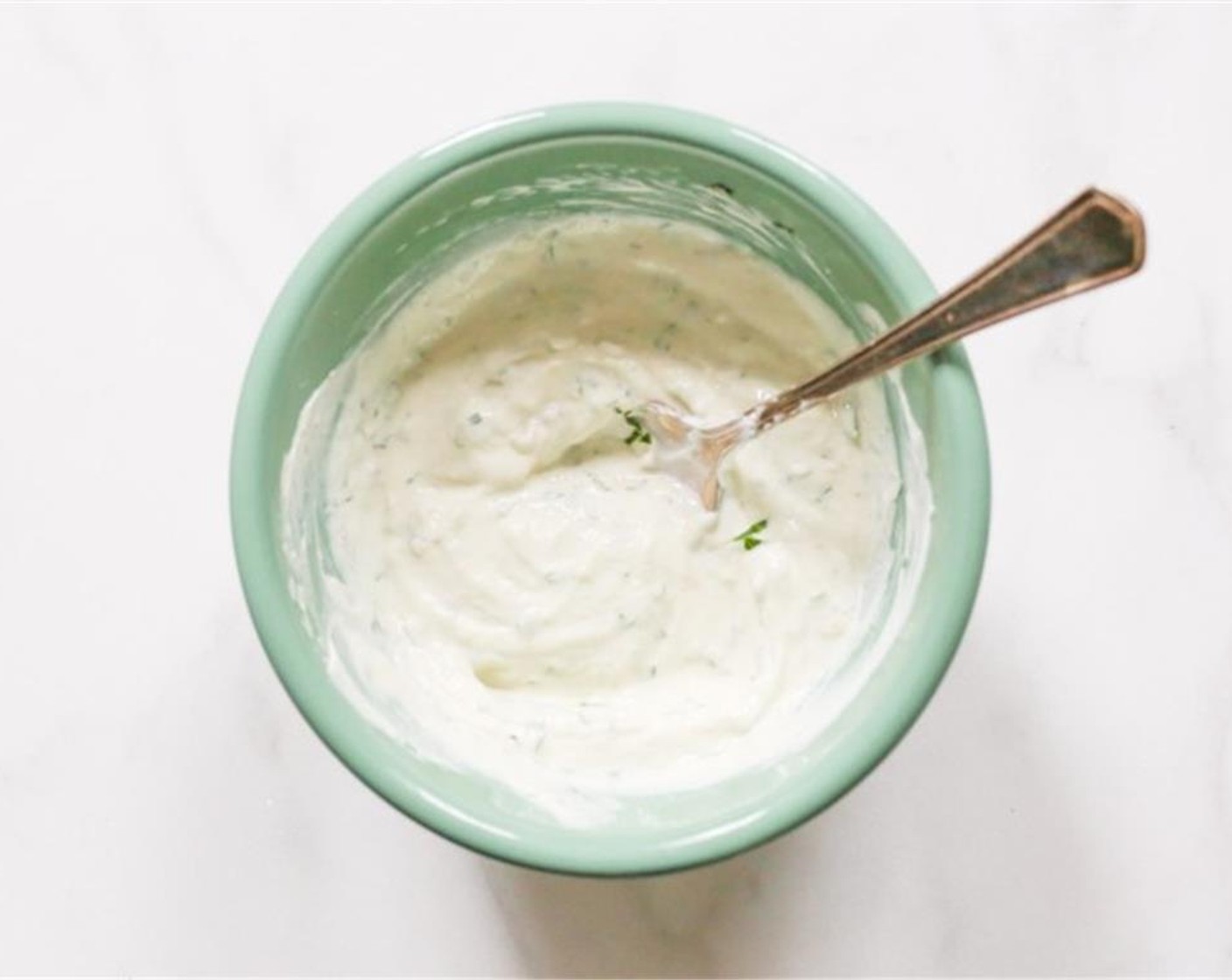step 6 Meanwhile whip up the harissa yogurt sauce. Combine the Nonfat Plain Greek Yogurt (3/4 cup), Lemon (1/2), Italian Flat-Leaf Parsley (1 Tbsp), Kosher Salt (to taste), Green Harissa (1 Tbsp), and Green Harissa (1 teaspoon) in a small bowl.