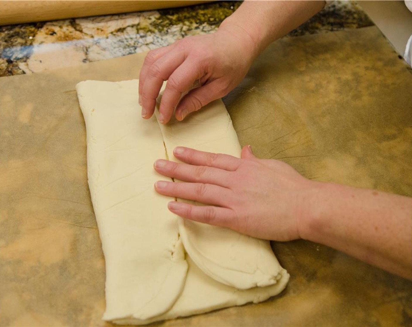 step 8 Fold the top and bottom edges of the dough over the butter.