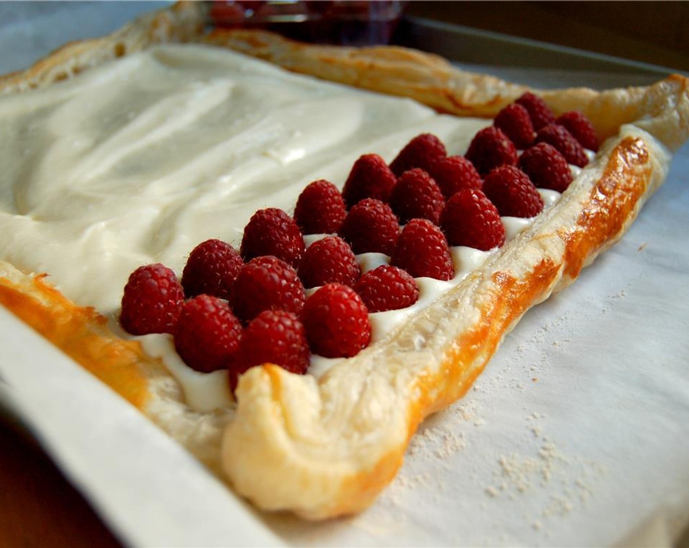 step 8 Spread the creamy mixture on the cooled tart shell. Place Fresh Raspberries (2 cups) on top of the cream cheese layer.