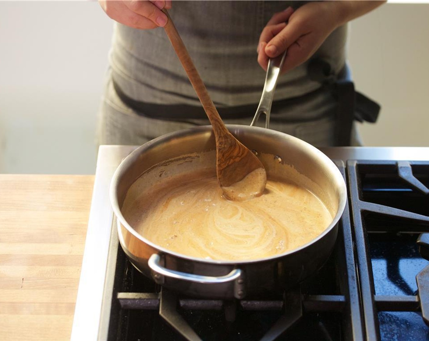 step 5 In a large, deep saute pan over medium high heat, add Vegetable Oil (1 Tbsp). Add the Vindaloo Curry Powder (1 Tbsp) and fresh ginger. Toast for thirty seconds. Be careful not to burn.