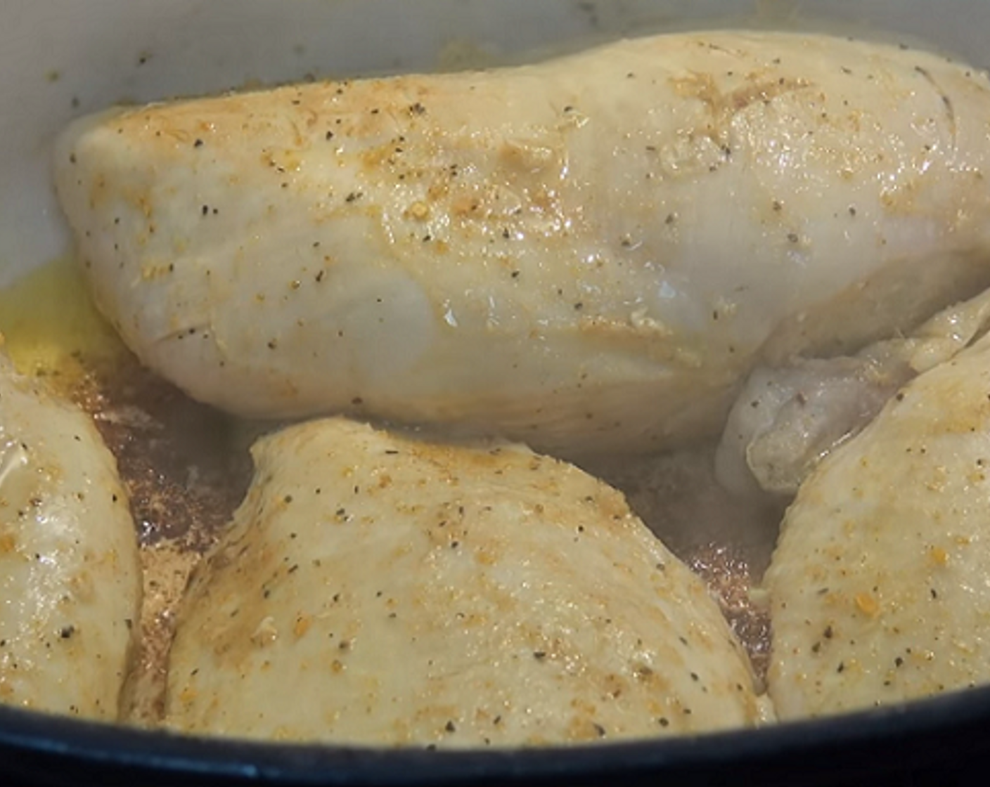 step 2 In a flame-proof roasting pan, add some Olive Oil (as needed) and place the seasoned chicken. Brown on medium heat for about two minutes on each side, or until nicely browned. Transfer to a plate and set aside.