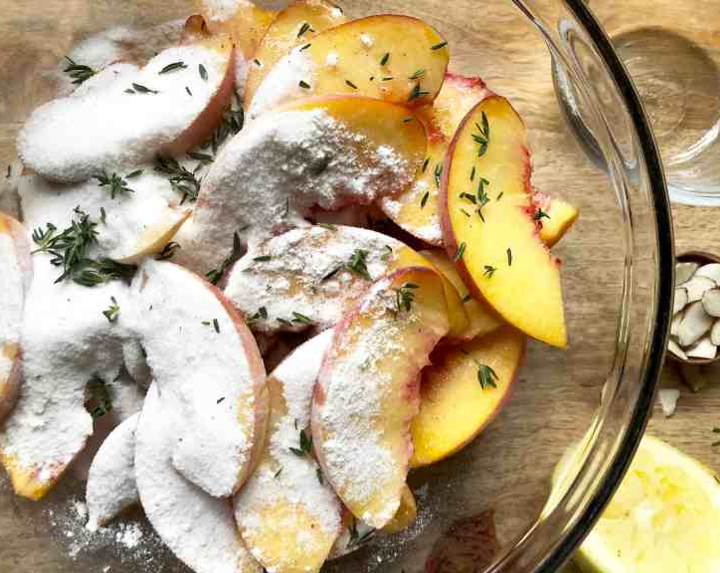 step 6 Mix the Granulated Sugar (4 Tbsp), Unbleached All Purpose Flour (4 Tbsp), and Ground Nutmeg (1/4 tsp) in a small bowl. Sprinkle the sugar mixture, along with the Fresh Thyme (1 tsp) on top of the peaches. Toss again until all of the peaches are coated.