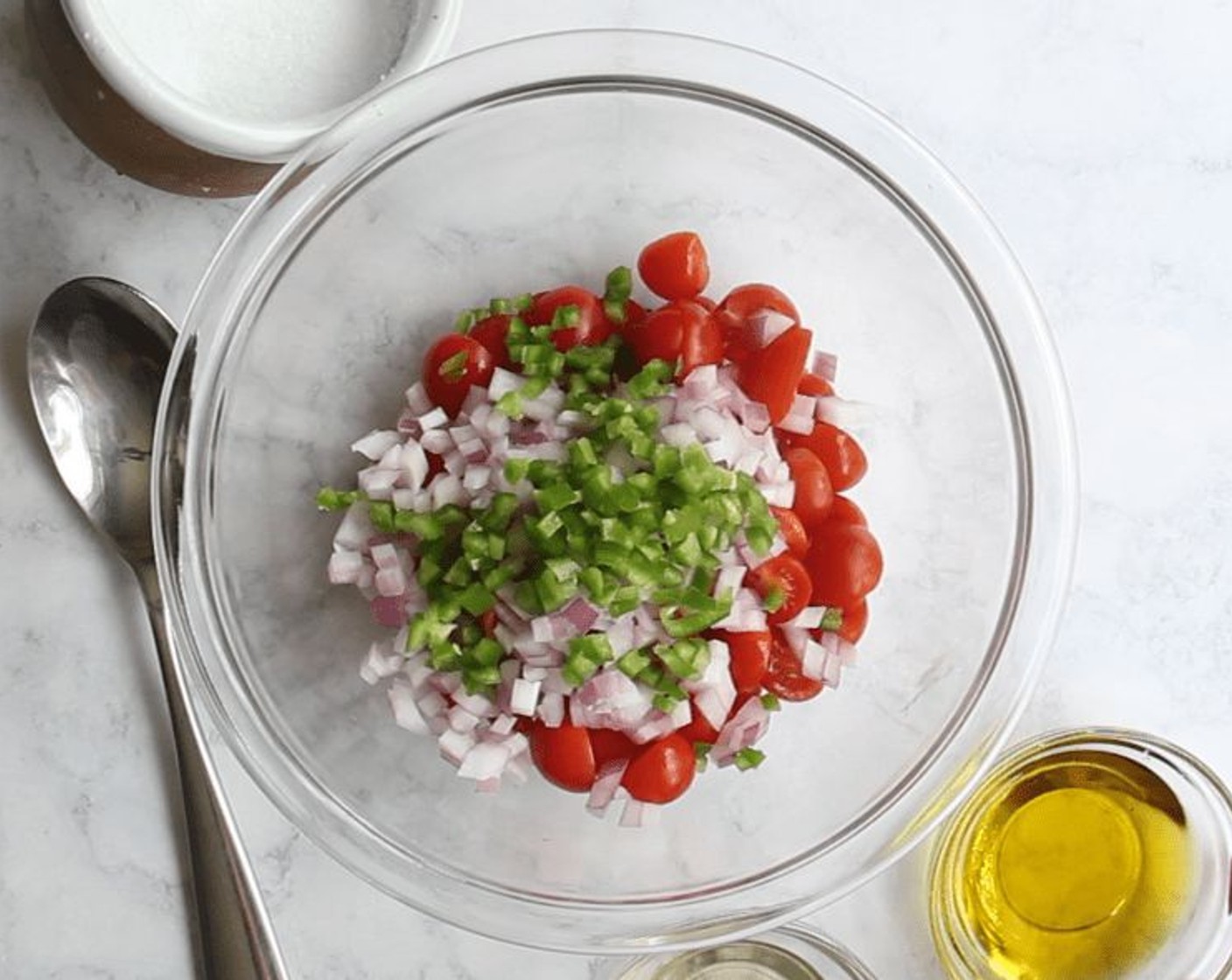 step 7 Make the salsa: In a medium bowl, combine the Cherry Tomatoes (1 1/4 cups), Red Onion (1/2 cup), Jalapeño Pepper (1), Kosher Salt (1 pinch), Extra-Virgin Olive Oil (2 Tbsp), and White Balsamic Vinegar (1 Tbsp). Taste and adjust seasoning as needed.