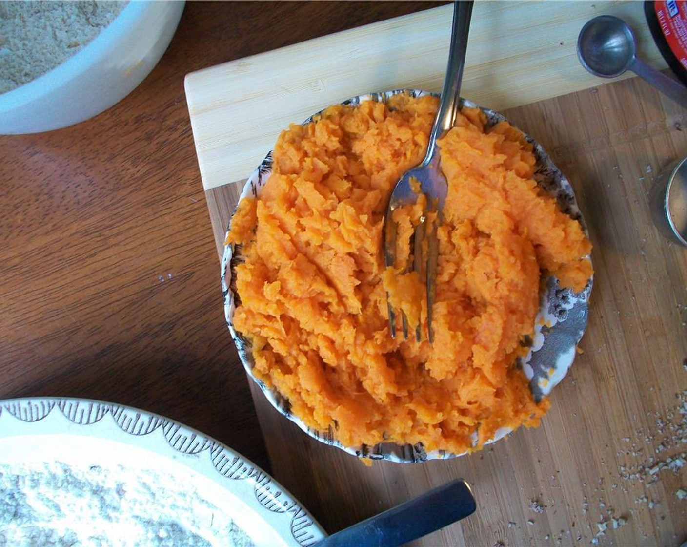 step 3 In a separate bowl, combine mashed Sweet Potato (1 cup), Granulated Sugar (1/4 cup), Brown Sugar (1/4 cup) and Vanilla Extract (1/2 tsp).