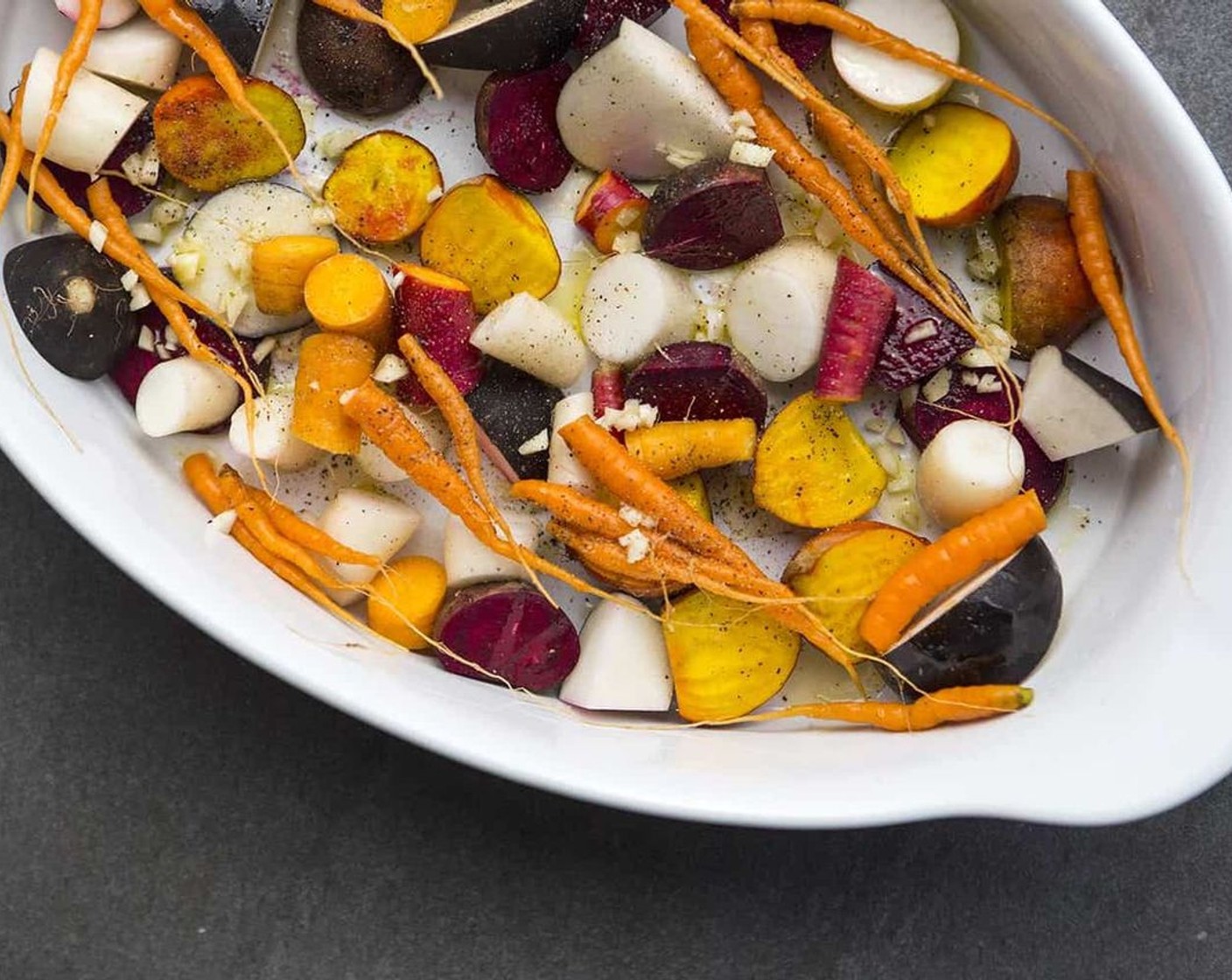 step 3 Pour the marinade into a roasting pan and add Mixed Vegetables (2 cups). Toss with Extra-Virgin Olive Oil (1/2 cup) and season with Coarse Salt (to taste) and Ground Black Pepper (to taste).