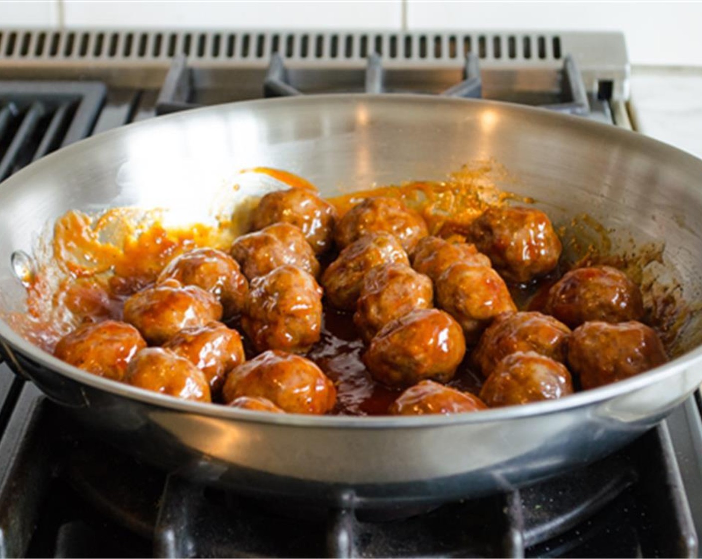 step 9 Add the baked meatballs to the sauce and stir to coat evenly.