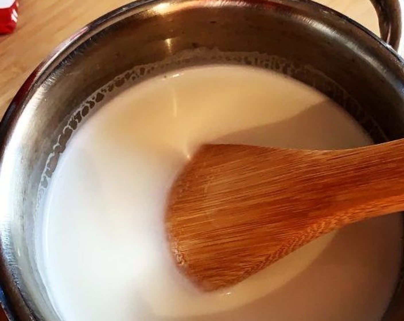 step 1 In a saucepan, heat up Whole Milk (13.5 oz) and Granulated Sugar (1/3 cup), turning off the heat just before it reaches boiling point. Stir well to make sure the sugar has dissolved