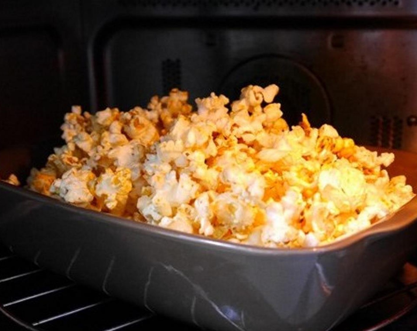 step 4 Place the popcorn on a tray and bake for 6 minutes at 300 degrees F (150 degrees C).