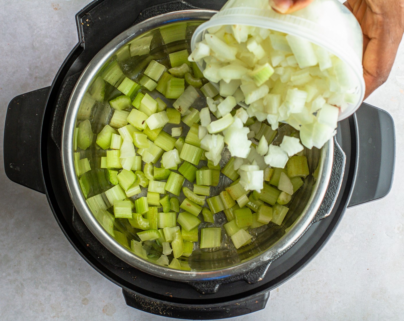 step 1 On a 6 or 8-quart Instant Pot, select the “sauté” mode. Add Unsalted Butter (1 Tbsp), Yellow Onion (1), Celery (3 stalks), Carrots (3), and Kosher Salt (3/4 tsp) and stir. Cook until the onions are translucent, approximately 7 minutes.
