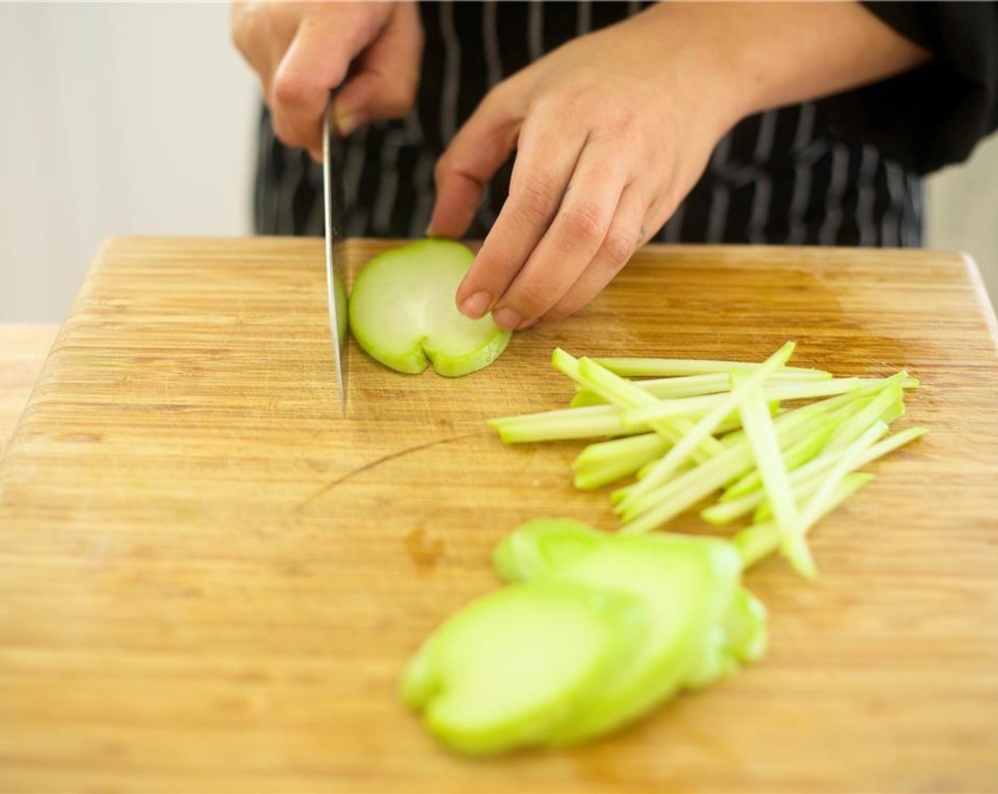 step 4 Cut Chayote Squash (1) into halves. Remove the seed and slice each half into quarter inch thick planks lengthwise. Next, stack planks and slice chayote into quarter inch julienned slices.