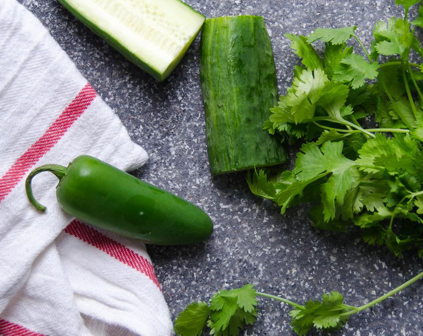 step 5 Mince the Jalapeño Pepper (1) and Cucumber (1/2 cup) into a quarter-inch dice. Prepare the chopped Fresh Cilantro (1/3 cup). Add to the same bowl.