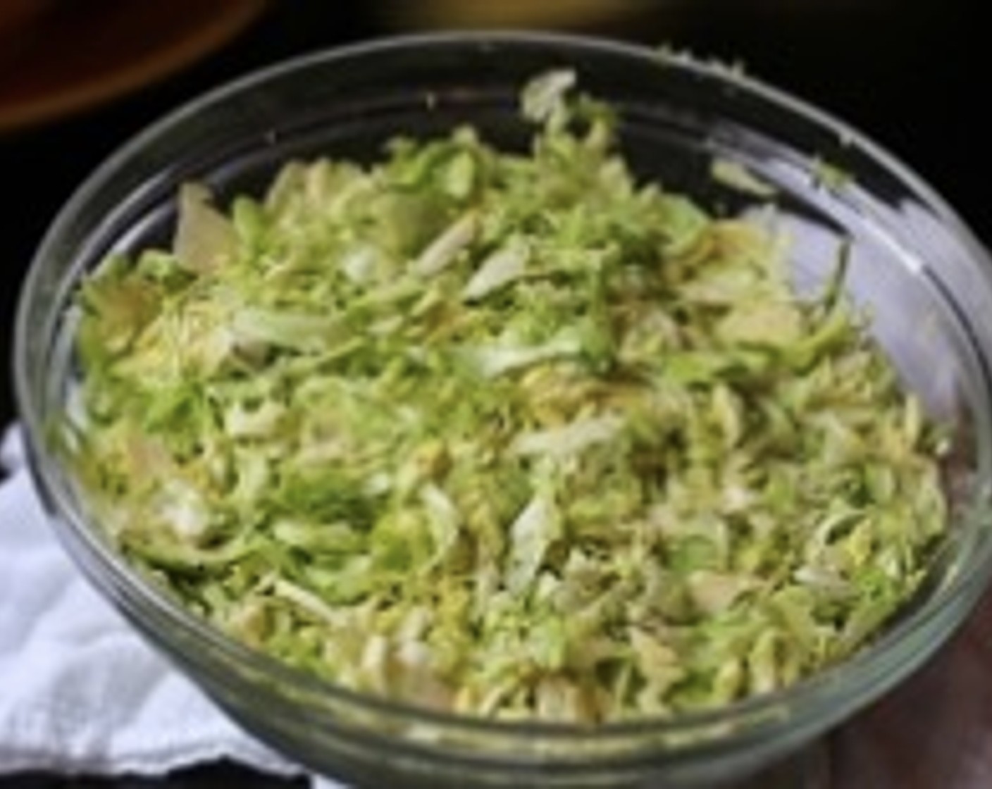 step 7 Using a mandoline, carefully shave each of the Brussels Sprouts (1 pckg), holding the stem end. Grate hard-boiled eggs on the fine side of the grater.