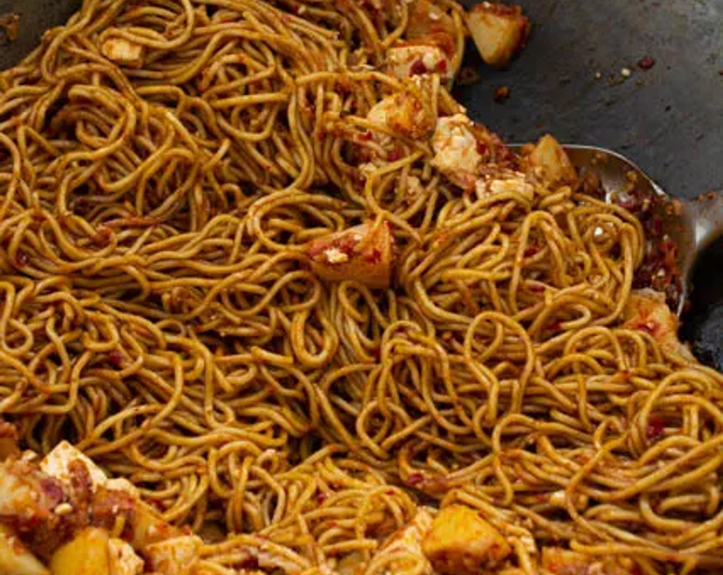 step 10 Add Yakisoba Noodles (1 lb) to the wok, then pour the sauce mix over the noodles. Toss until all the noodles are evenly coated in the sauce.