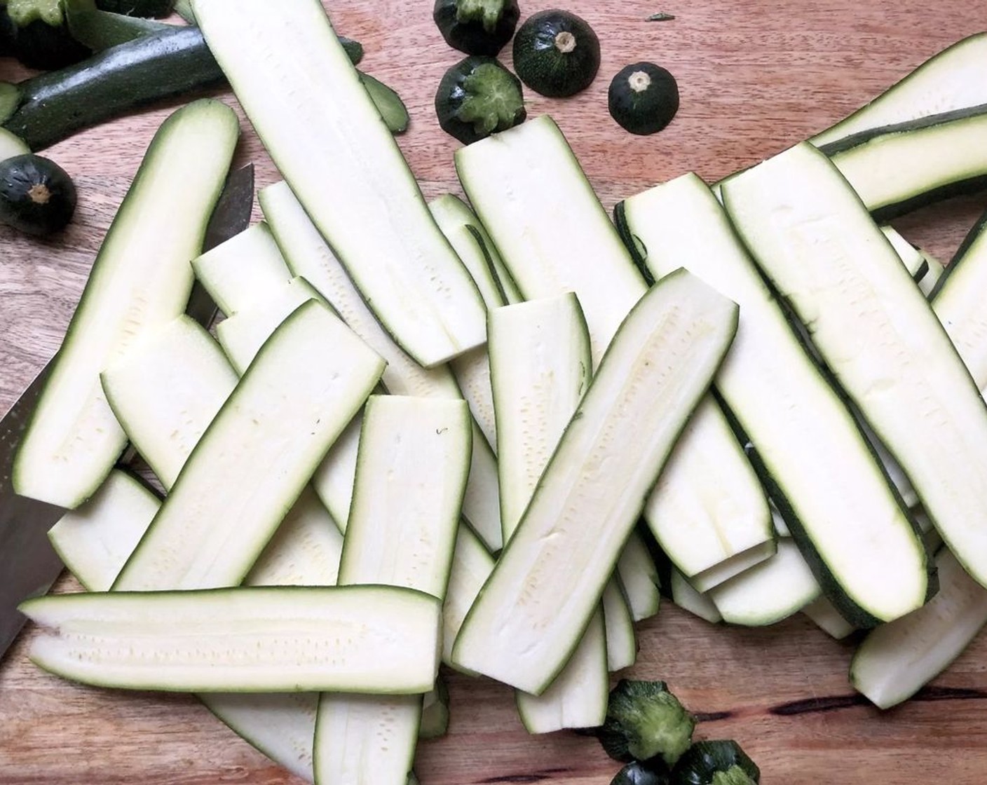 step 1 Rinse and dry the Zucchini (7 cups) and trim off the stem and the blossom ends. With a sharp knife, slice the squash lengthwise into strips about 1/8-inch thick; flexible but not paper-thin.