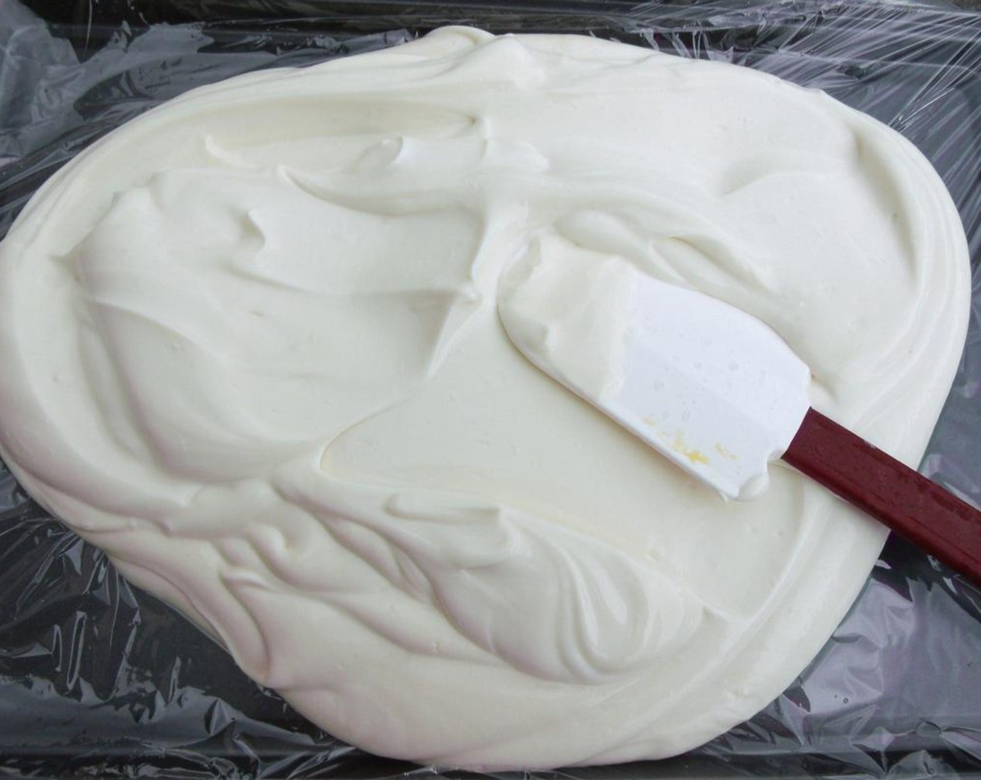 step 4 Spread the plain yogurt mixture evenly on the sheet pan.