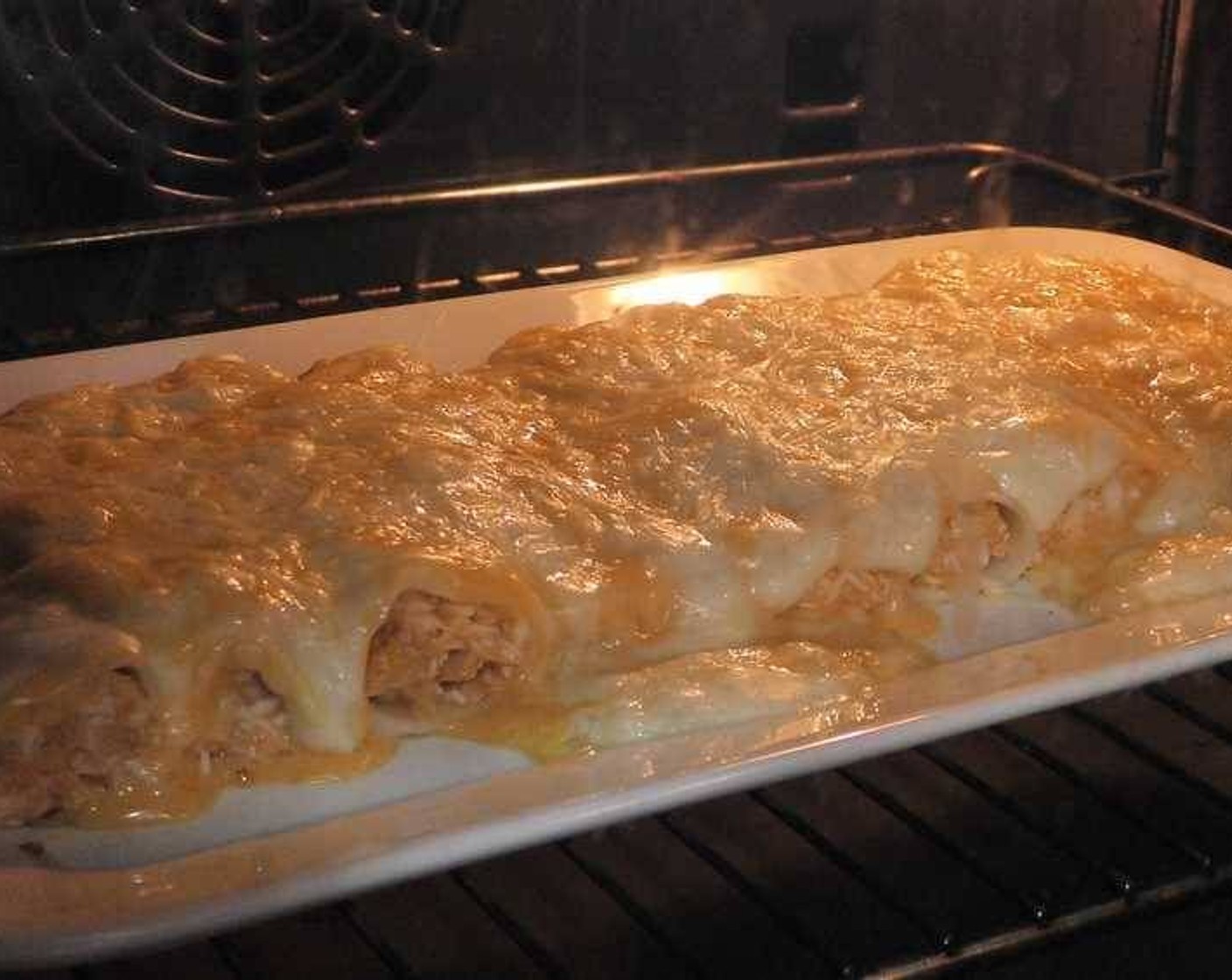step 6 Turn on the broil setting on your oven and once heated, place the cannelloni until the cheese melts and is golden brown.